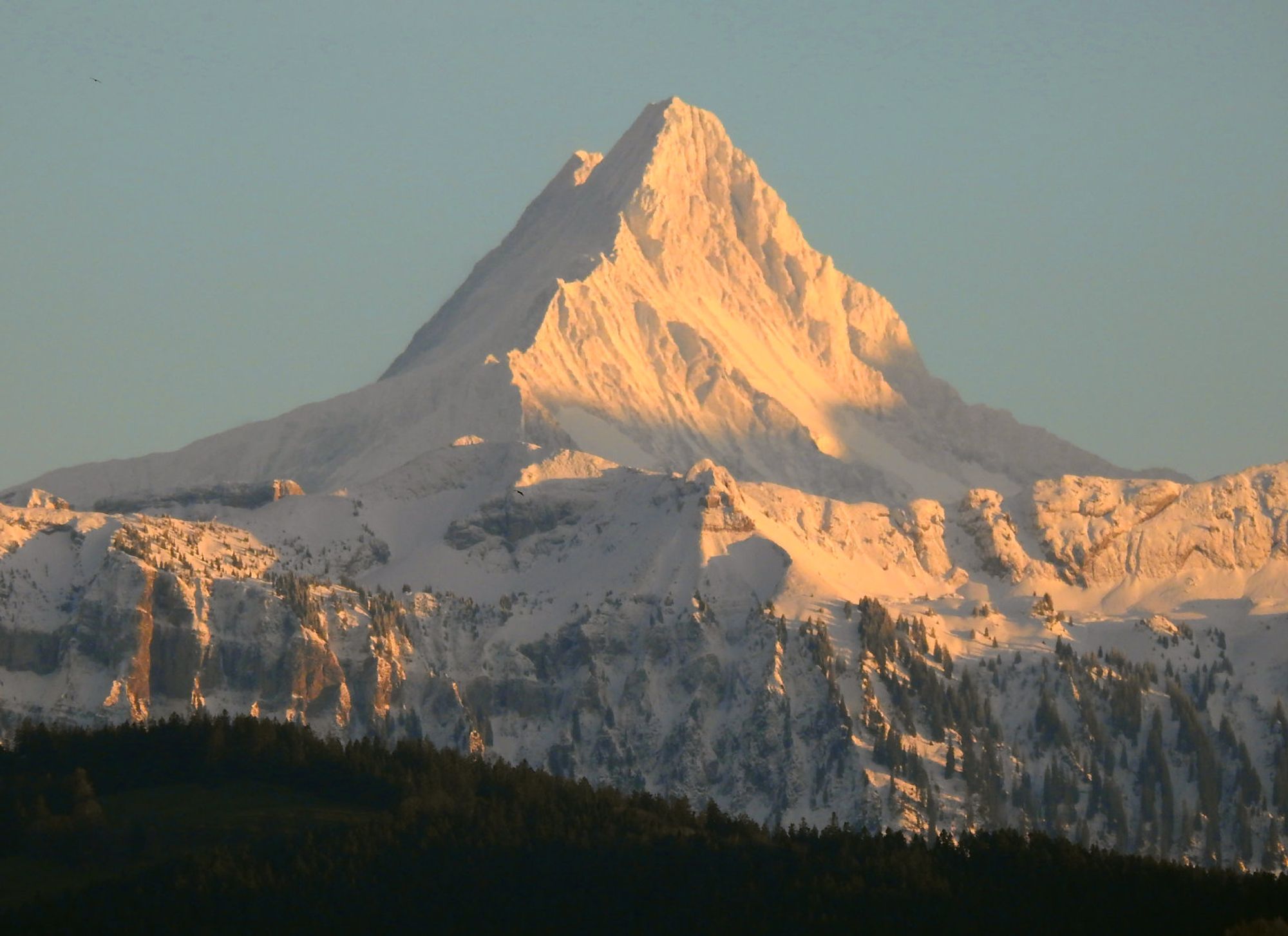 Snowy mountain as the sun goes down