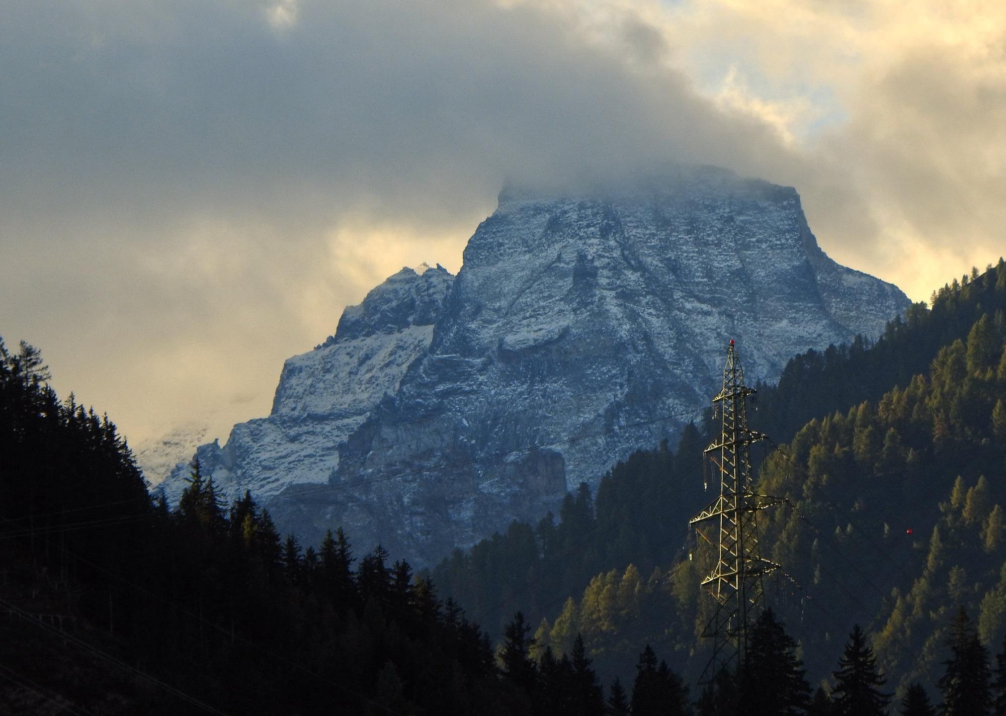 Cloudy mountain view with pylon (Valais, Switzerland)