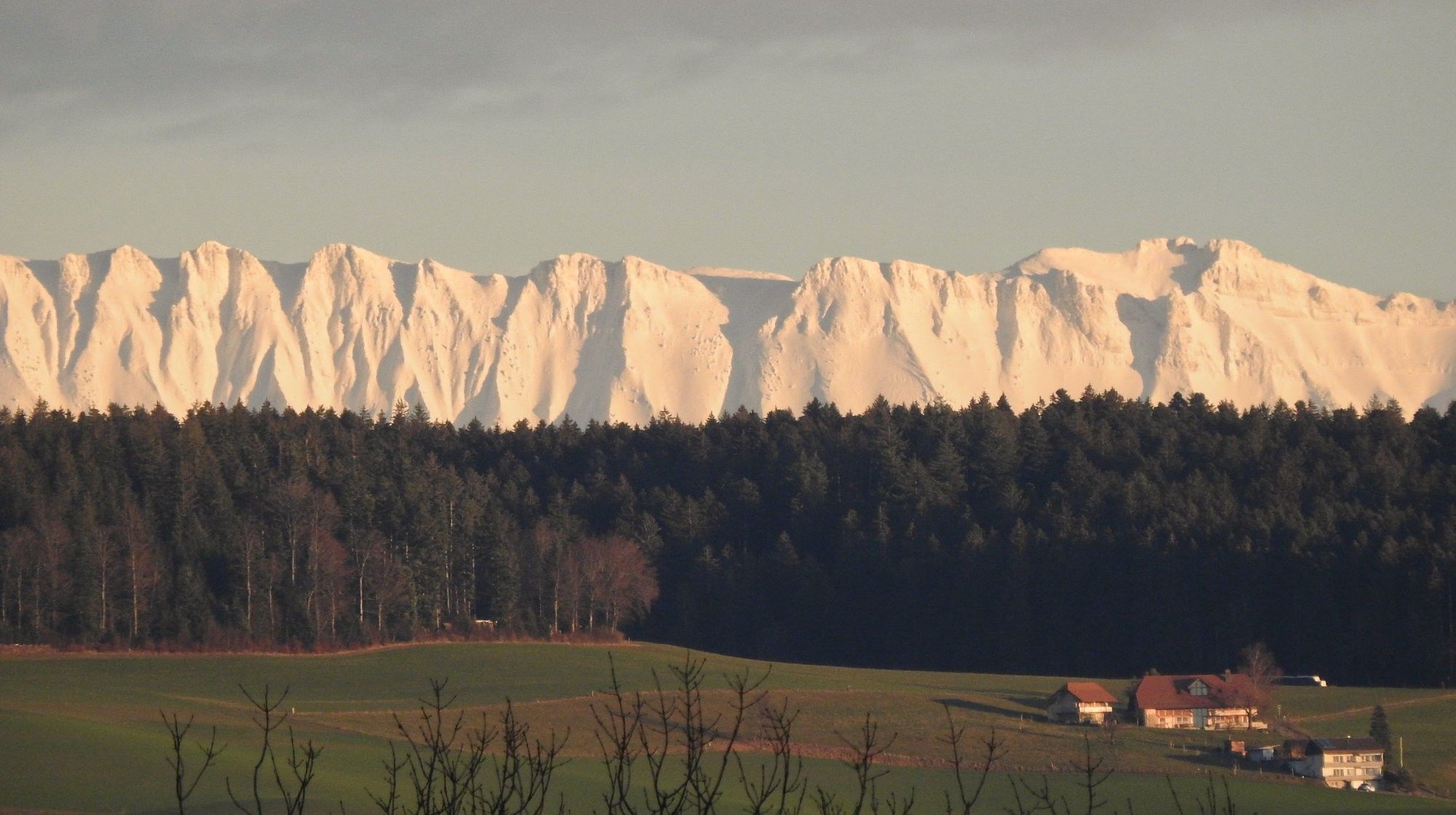 Snowy mountains as the sun goes down