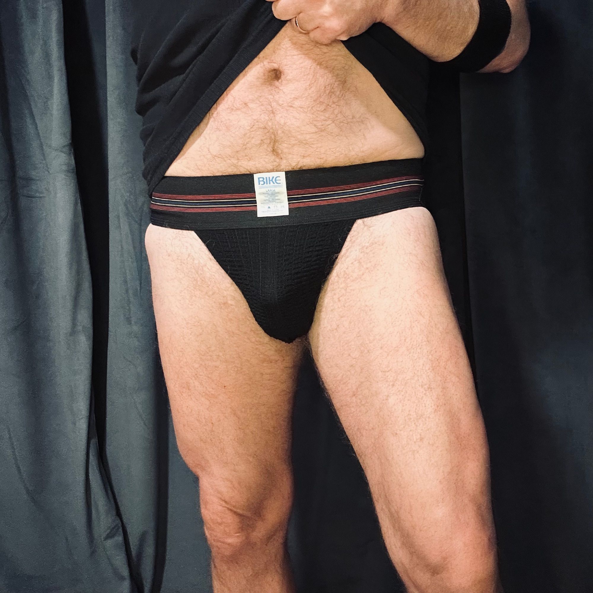 Bike athletic black 1874 jockstrap legs and torso from front