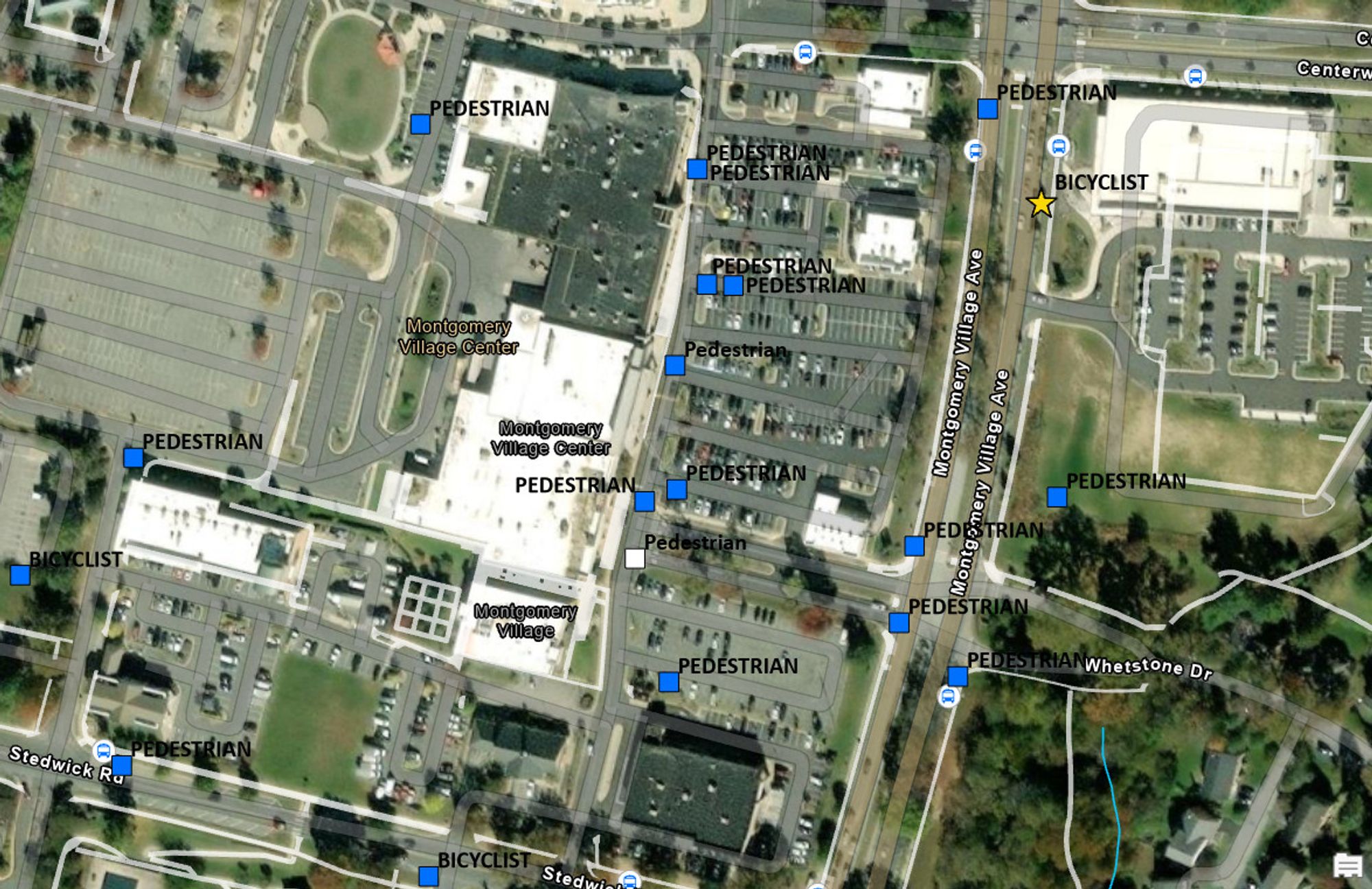 Satellite image of a shopping center with surface parking lots, and lots of blue squares, mostly labeled pedestrian.