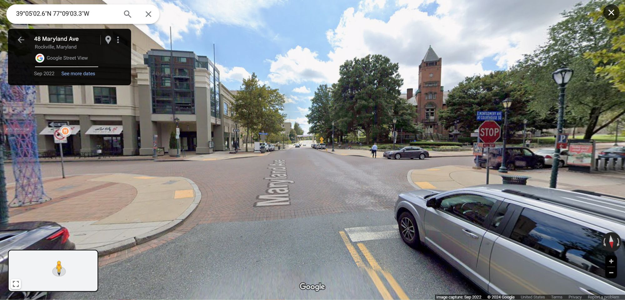 Google Streetview of a four-way intersection, controlled by stop signs, in downtown Rockville, next to the old red brick courthouse.