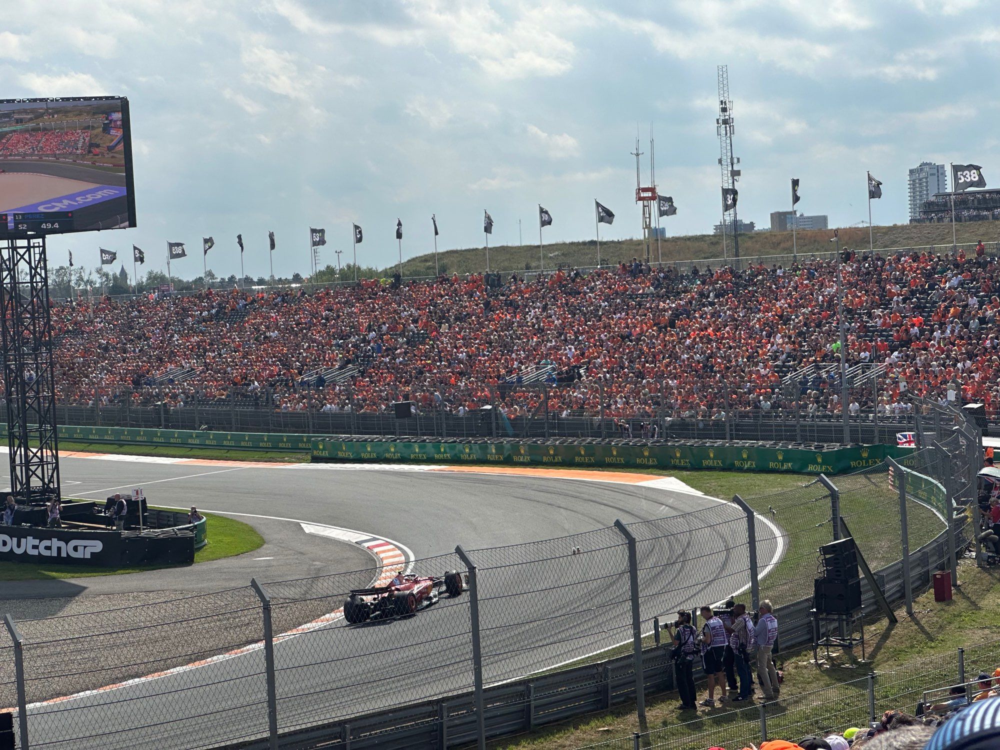 Ferrari driving past the arena grandstands at Zandvoort