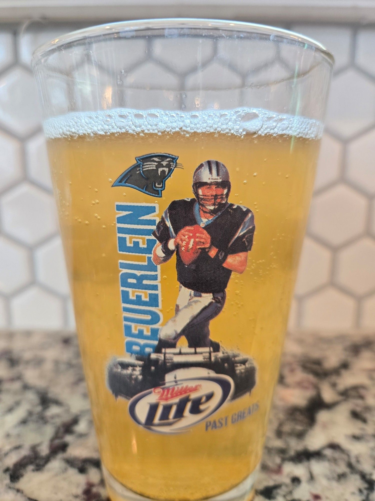 A beer glass, printed with Beuerlein the former, former, former, former, former, former, former QB of the Carolina Panthers