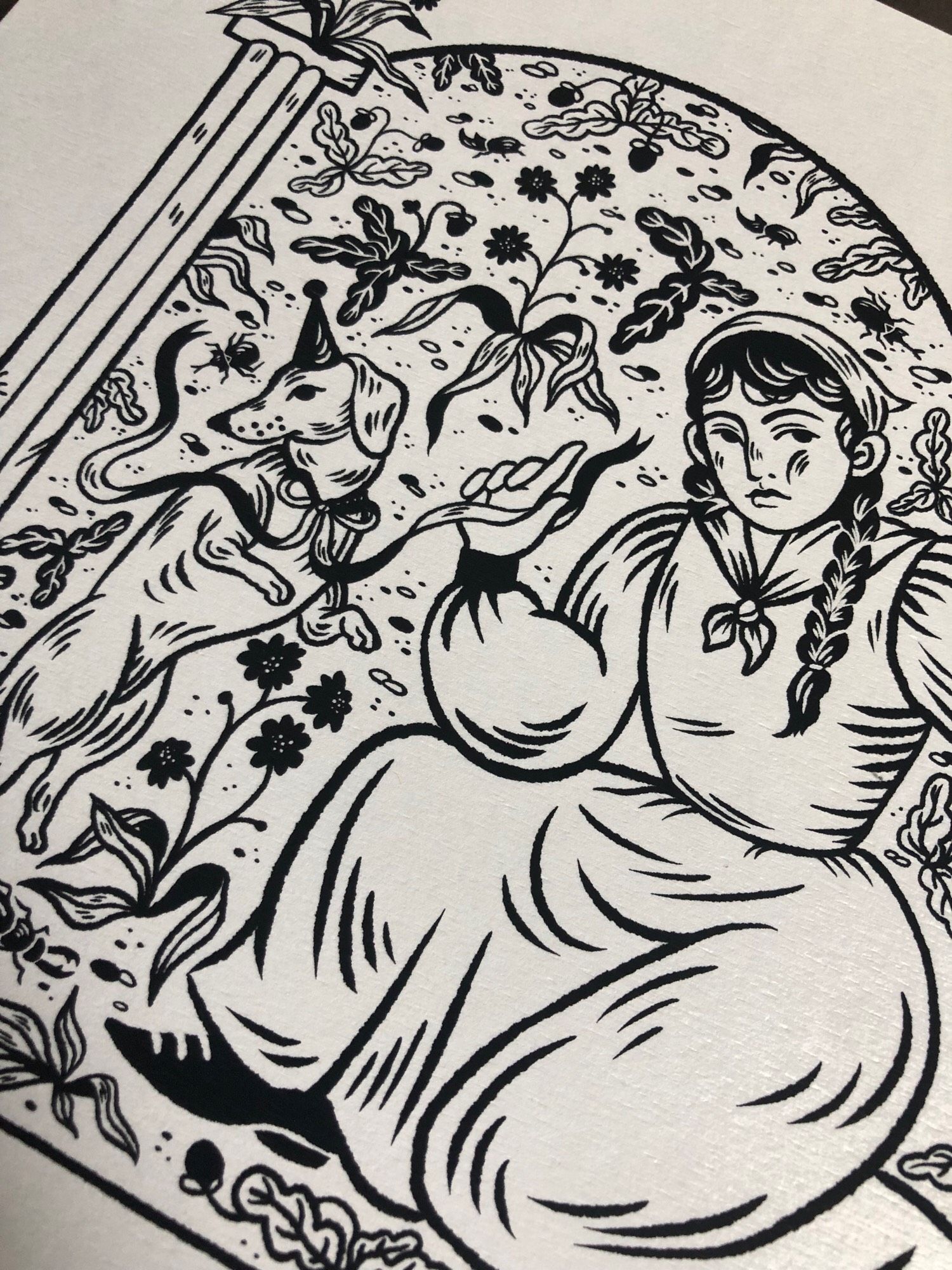 Detail of a black and white drawing of a woman and her two dogs among flowers.