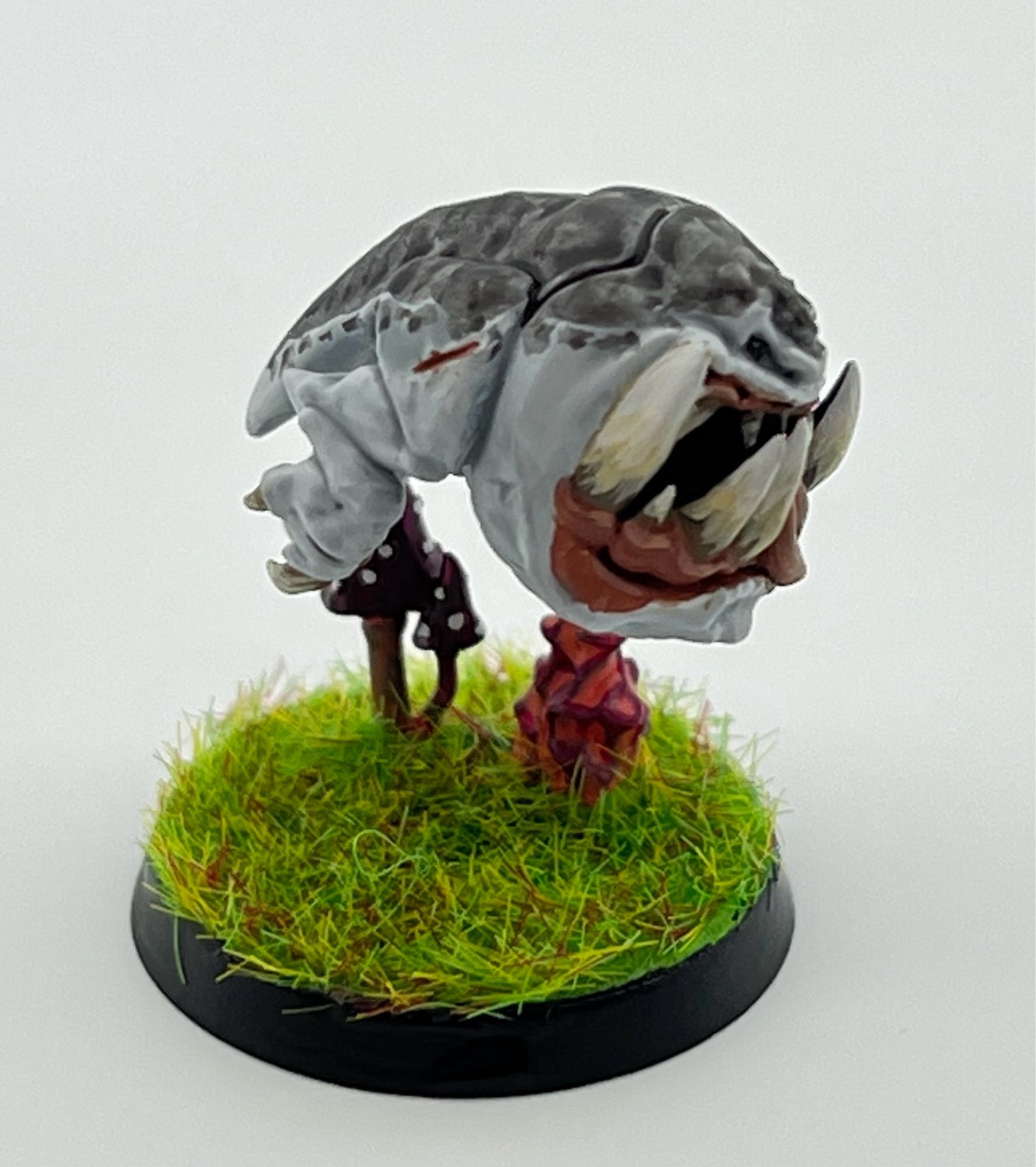 Shark squig!

A squig, think a two legged frog/lizard that’s mostly teeth and rage, in shark colours. Light grey underneath, darker on top. 

They’re bounding over the grass, probably looking to bite something