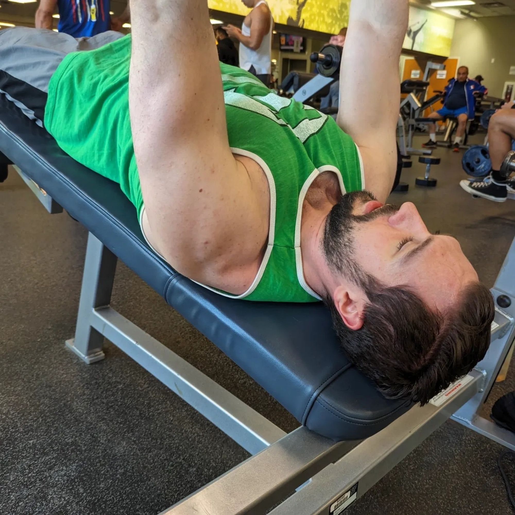 Man doing decline dumbbell chest press