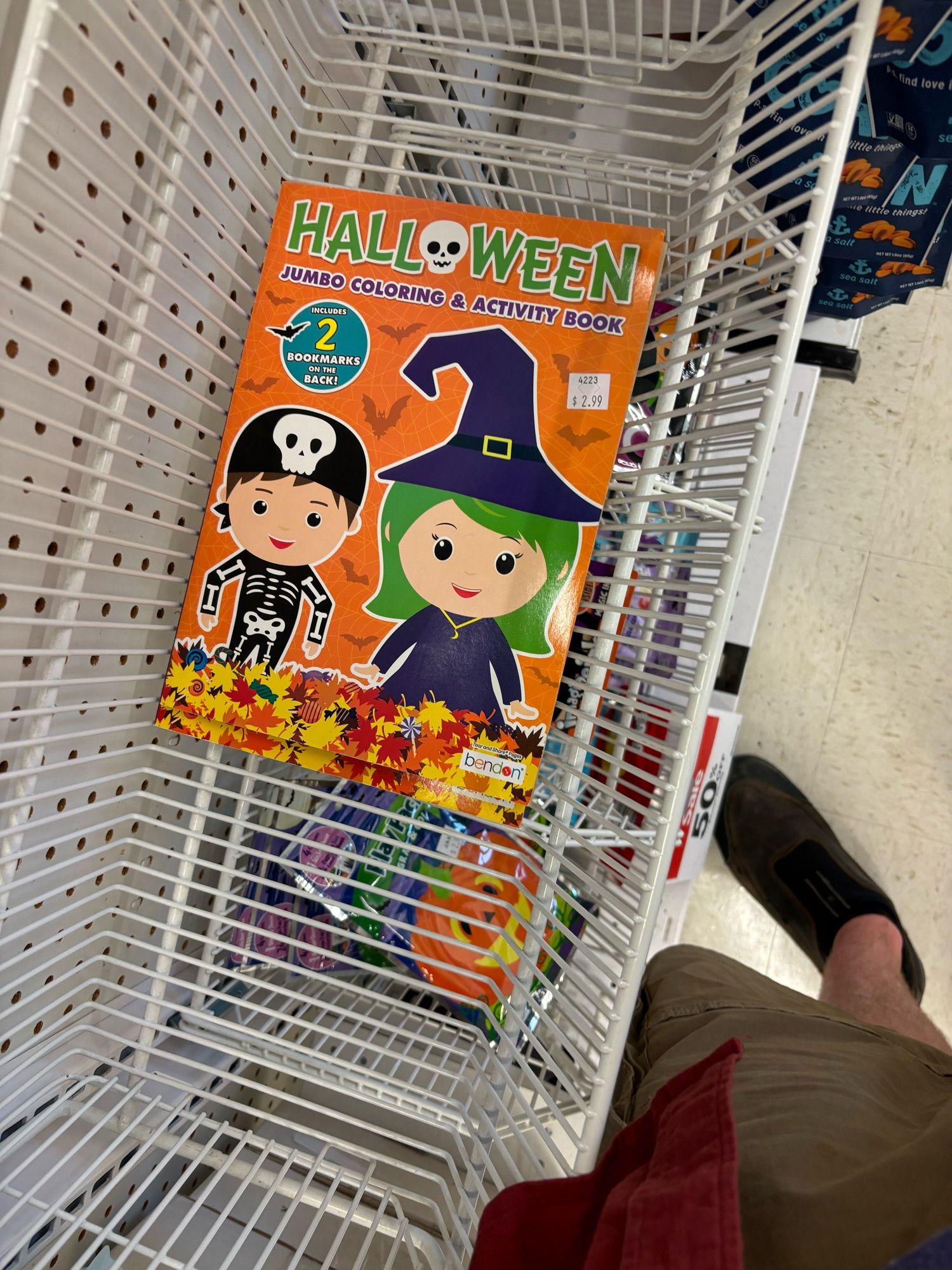 Halloween activity book featuring a green haired witch on the cover