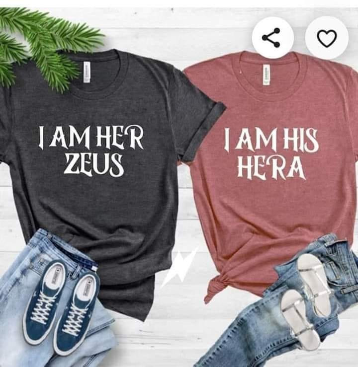 two shirts side by side, gray one says "I am her Zeus" and pink one says "I am his Hera"