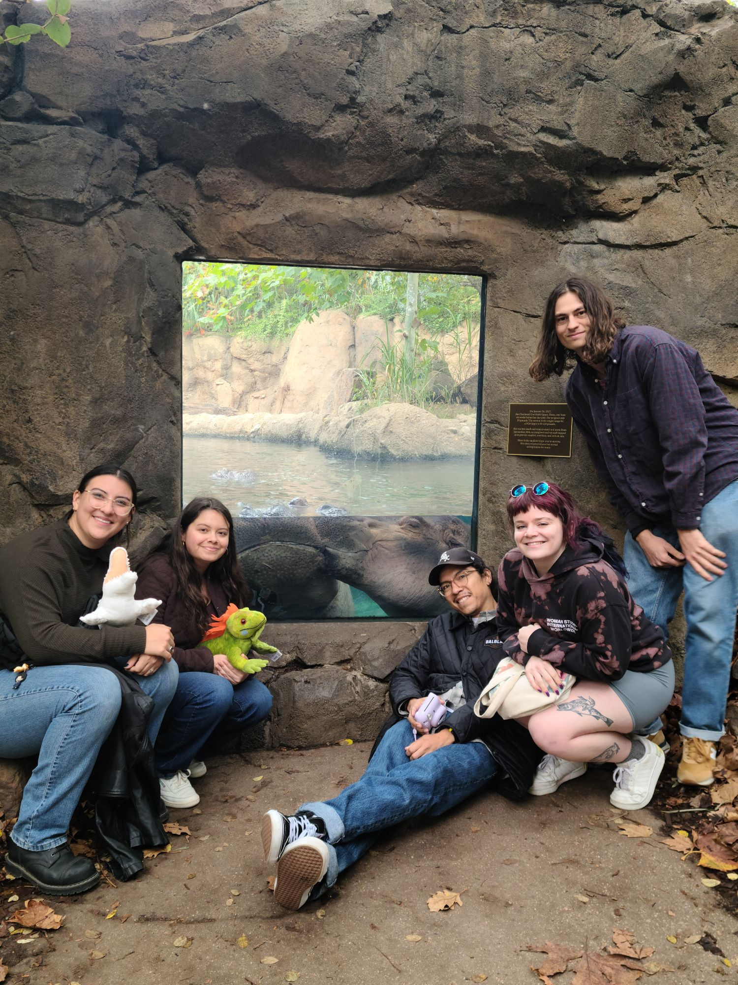 A group of paleontologists meeting Fiona the hippo for the first time