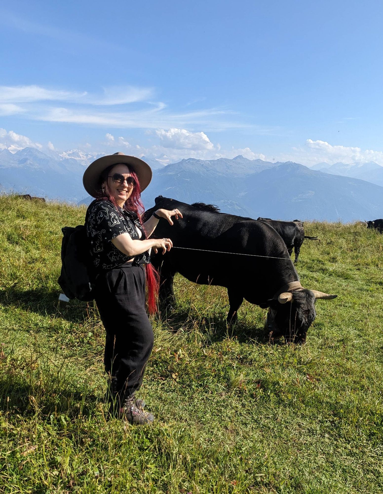 Photo of me next to a picturesque swiss cow.