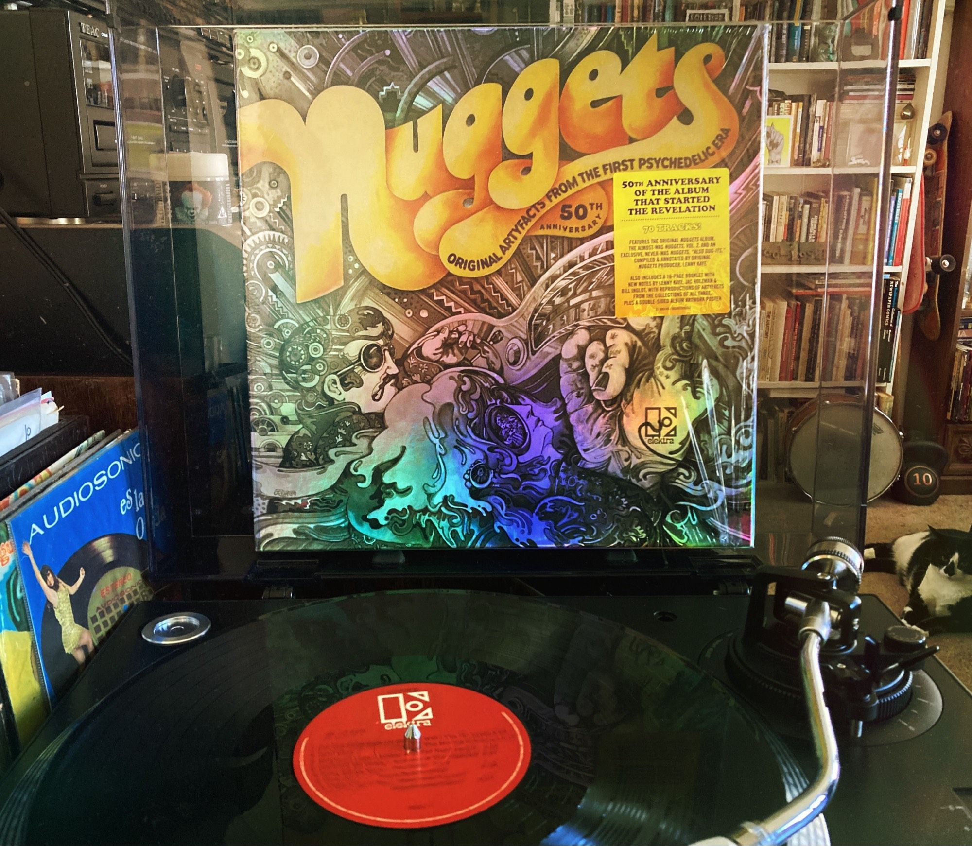 The cover for the 50th anniversary Nuggets box, an lp spinning on the deck