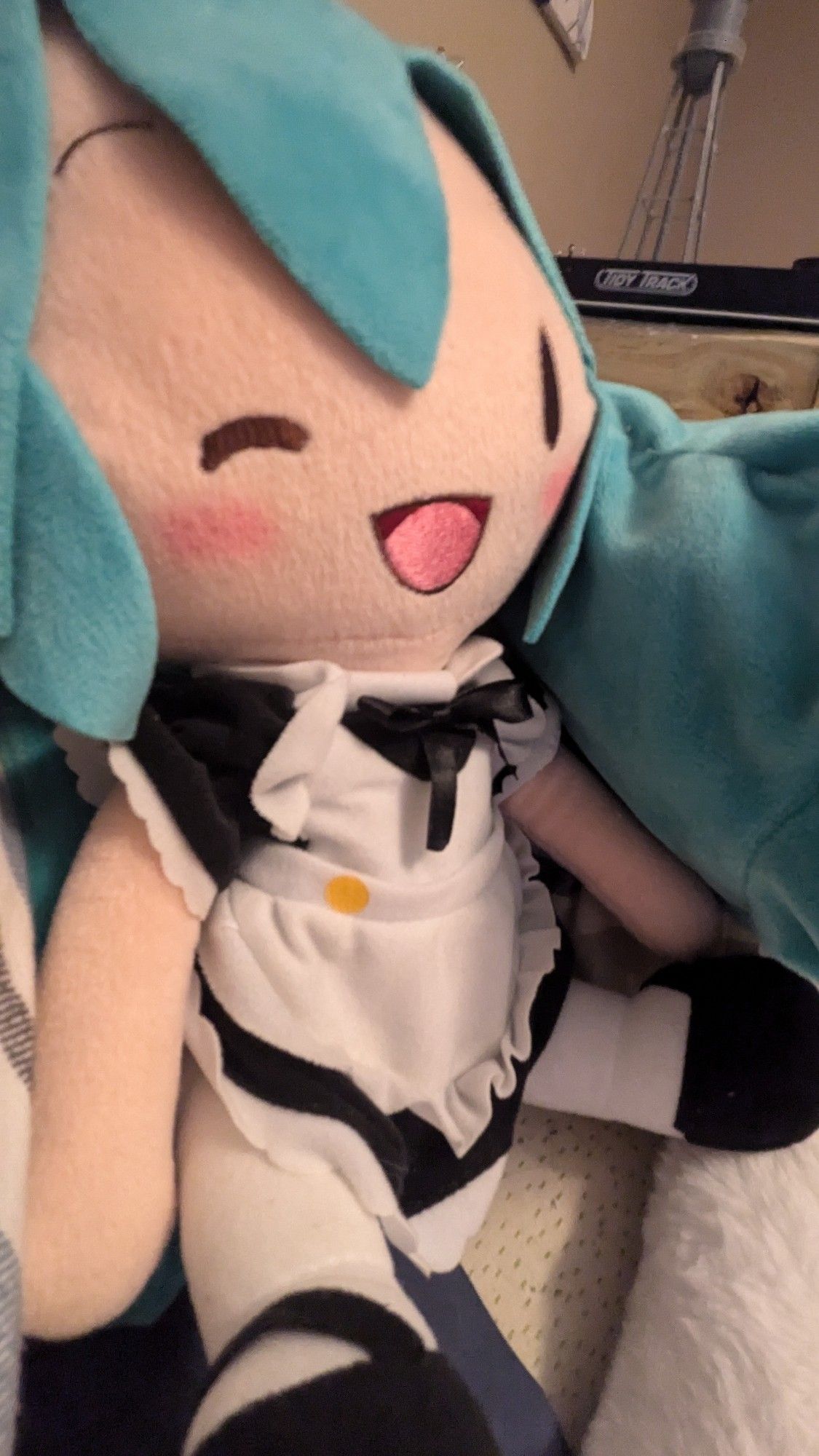 Adorable Miku maid plush, perfect for cuddles and decoration.