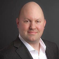 Billionaire cop lover Marc Andreesen whose head can only be described as egg like. It is not even mean, just factually accurate, to say his skull shape is identical to that of an egg laid by a bird. It's not a forehead or a five head, it is a fifty head.