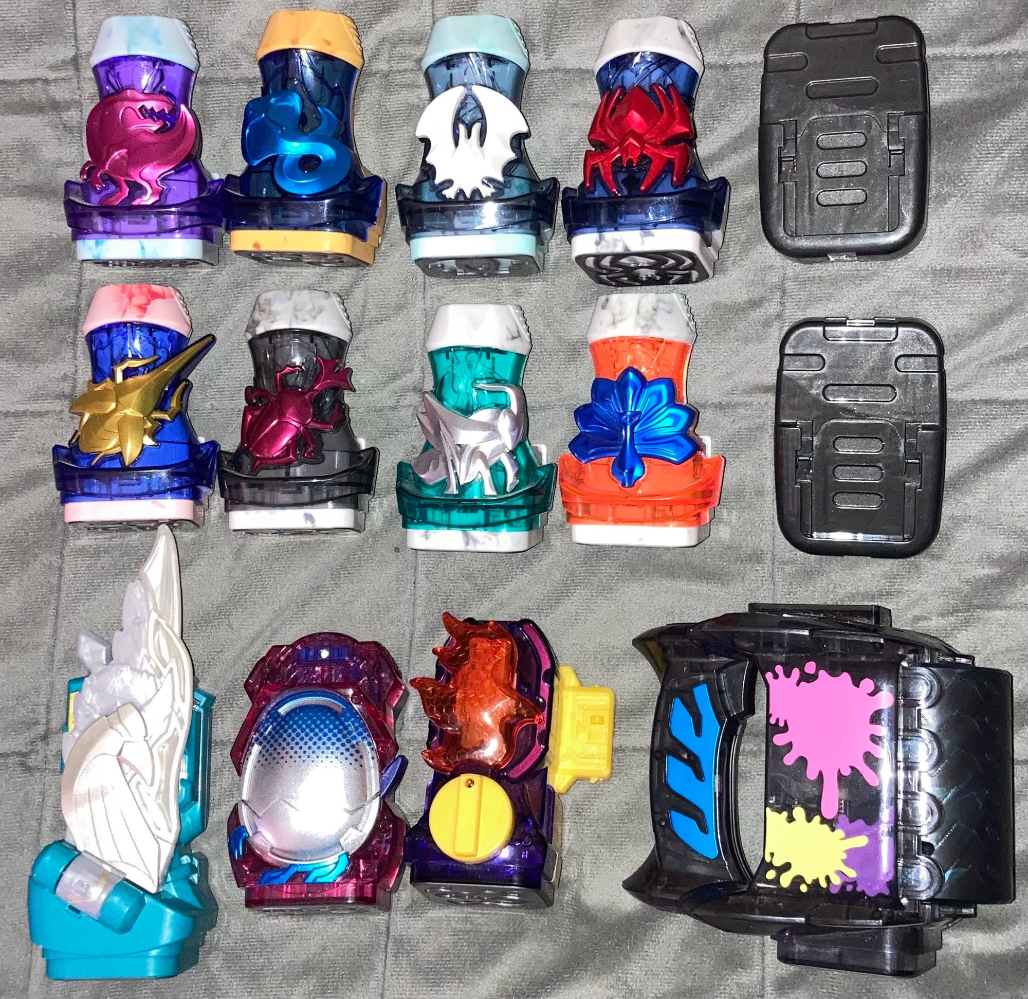 Various ViStamps from Kamen Rider Revice, along with a pair of holders.