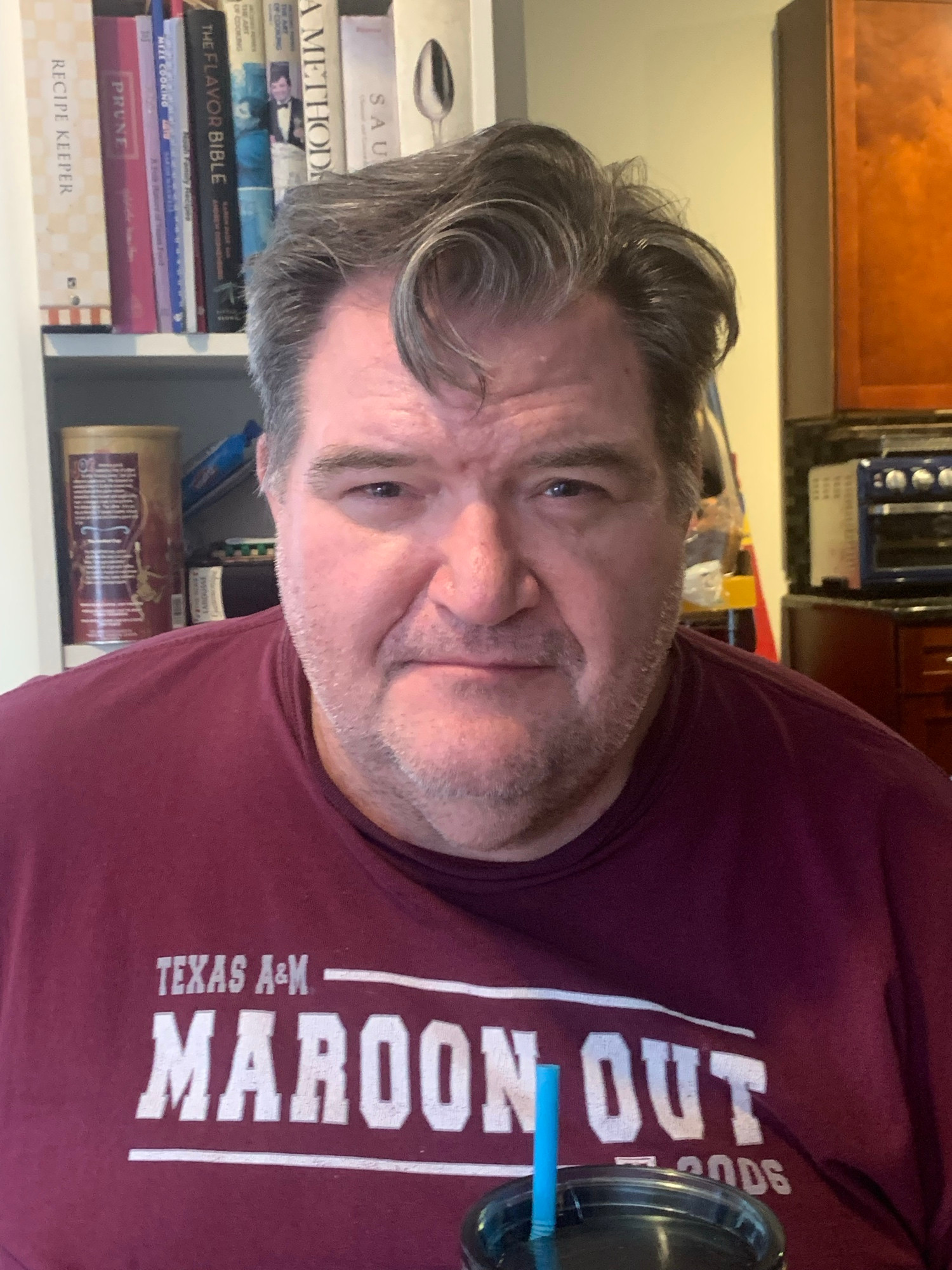 Husband in maroon shirt with adorable forehead curl