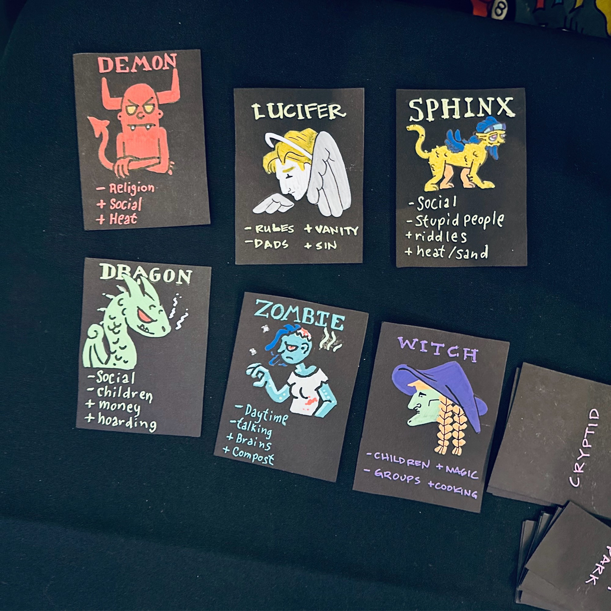 Game cards describing various mythological creatures and their preferences