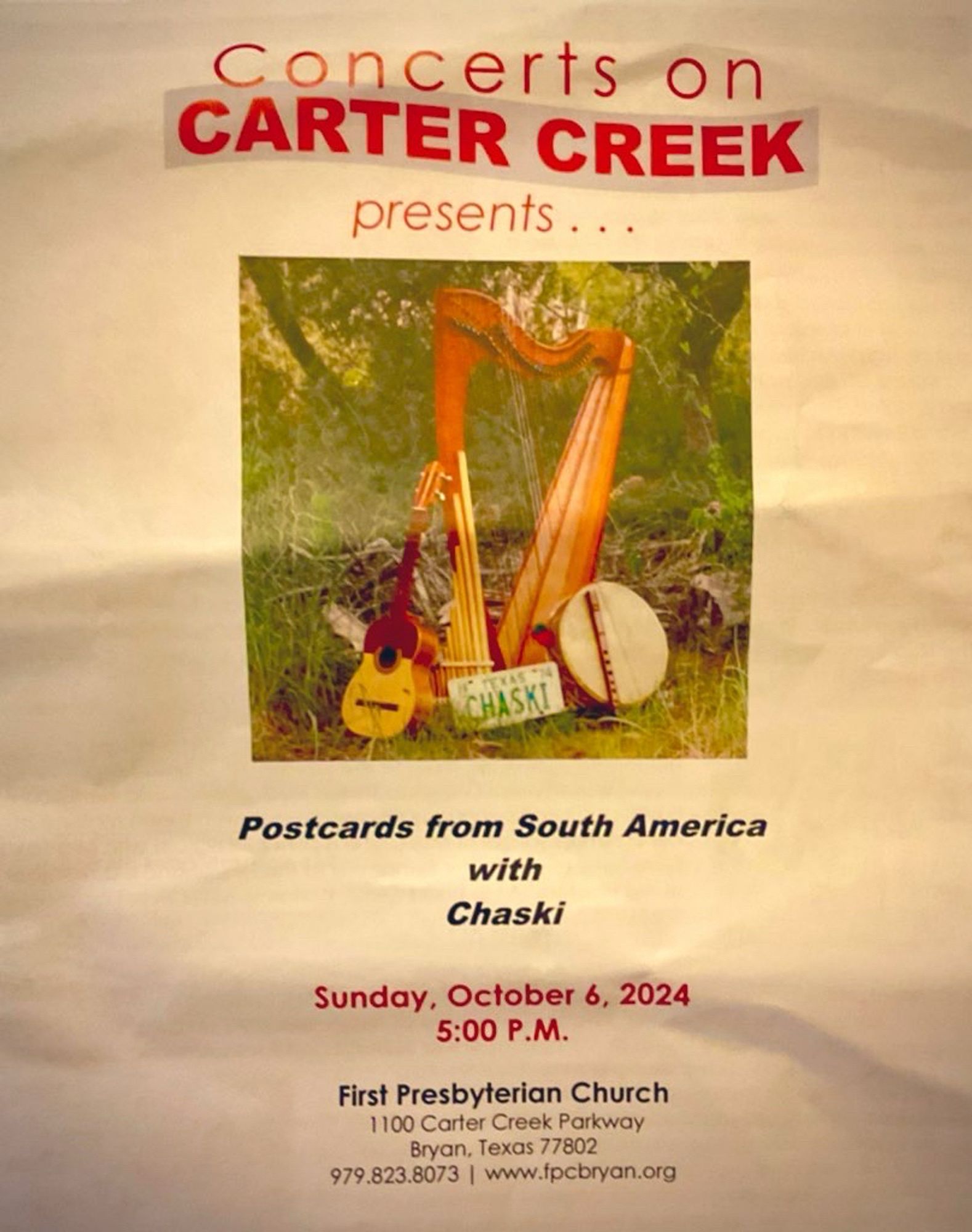 A photo of the program from Chaski’s performance at the Concerts on Carter Creek series. The title of our program is: Postcards from South America. The photo is of my small harp, outdoors amidst some live oak trees, surrounded by other instruments we used. Leaning against the bass of the harp is an old Texas license plate with the letters CHASKI in vivid green.