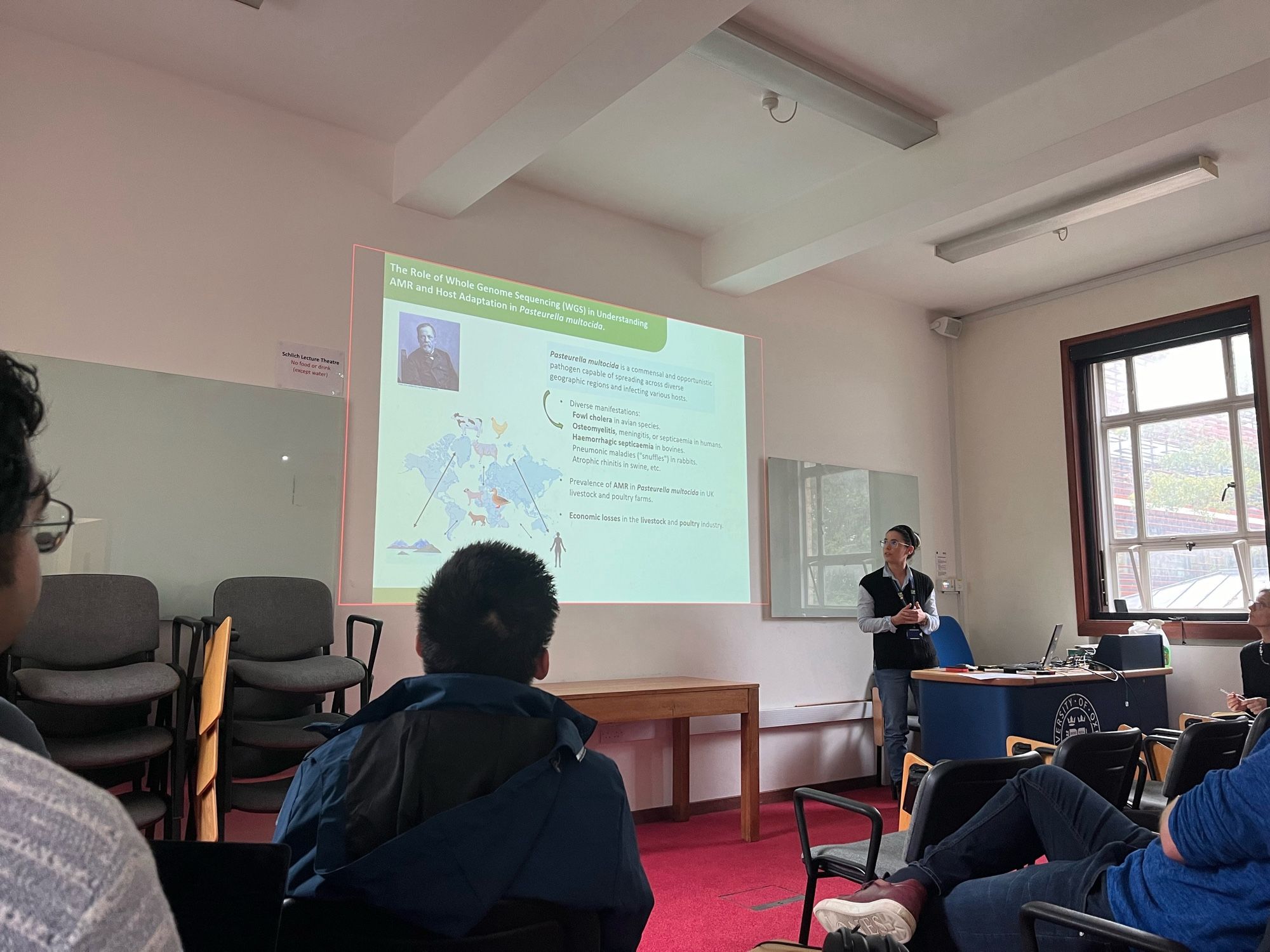 Angela presenting her work on Pasturella multocida to a room of people