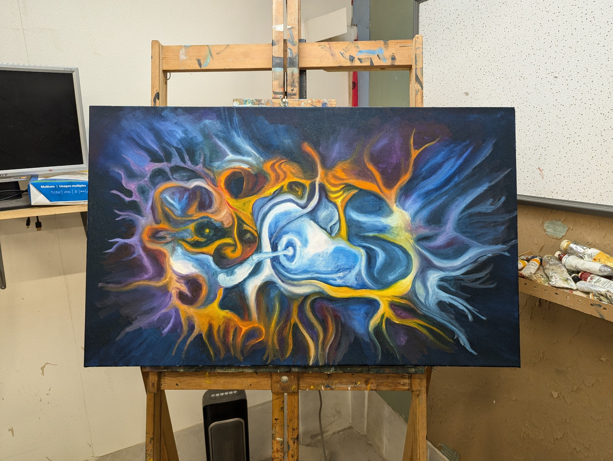 WIP painting of a nebula with swirling yellow orange blue & purple cloud with a white center. 