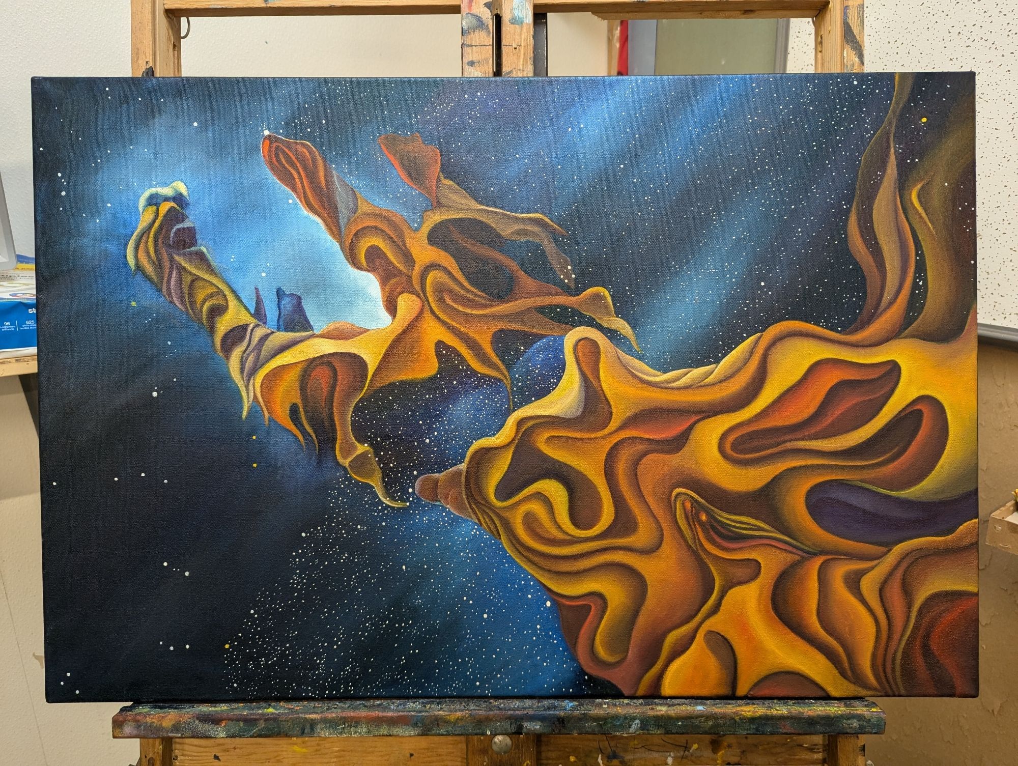 WIP painting of a nebula that looks like a hand with orange yellow clouds and lots of stars... But not enough yet.