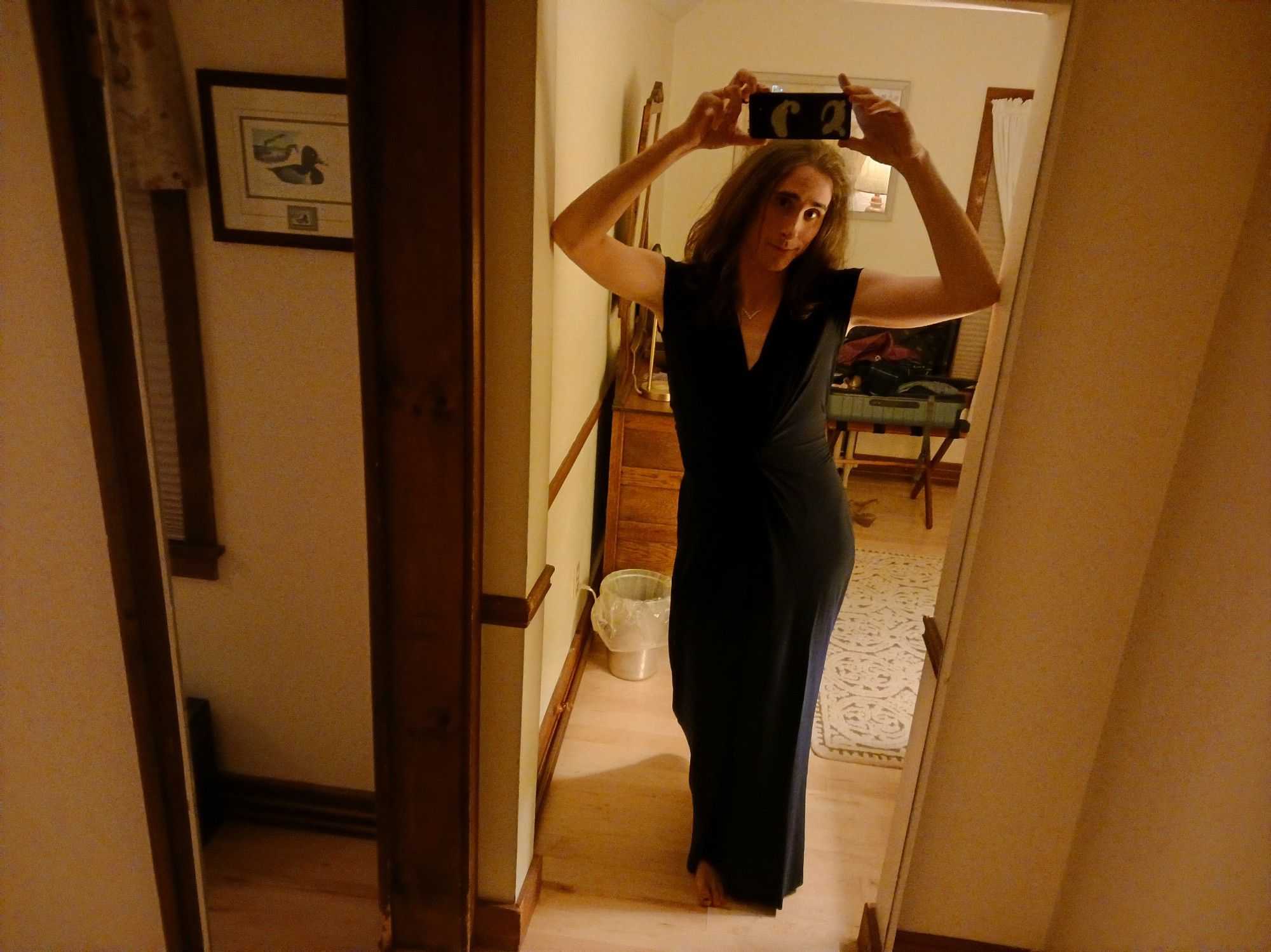 Full length mirror selfie of Cassie in her dark navy jumpsuit, shoulder length brown hair down. I'm holding the camera high because I wanted the whole outfit to show