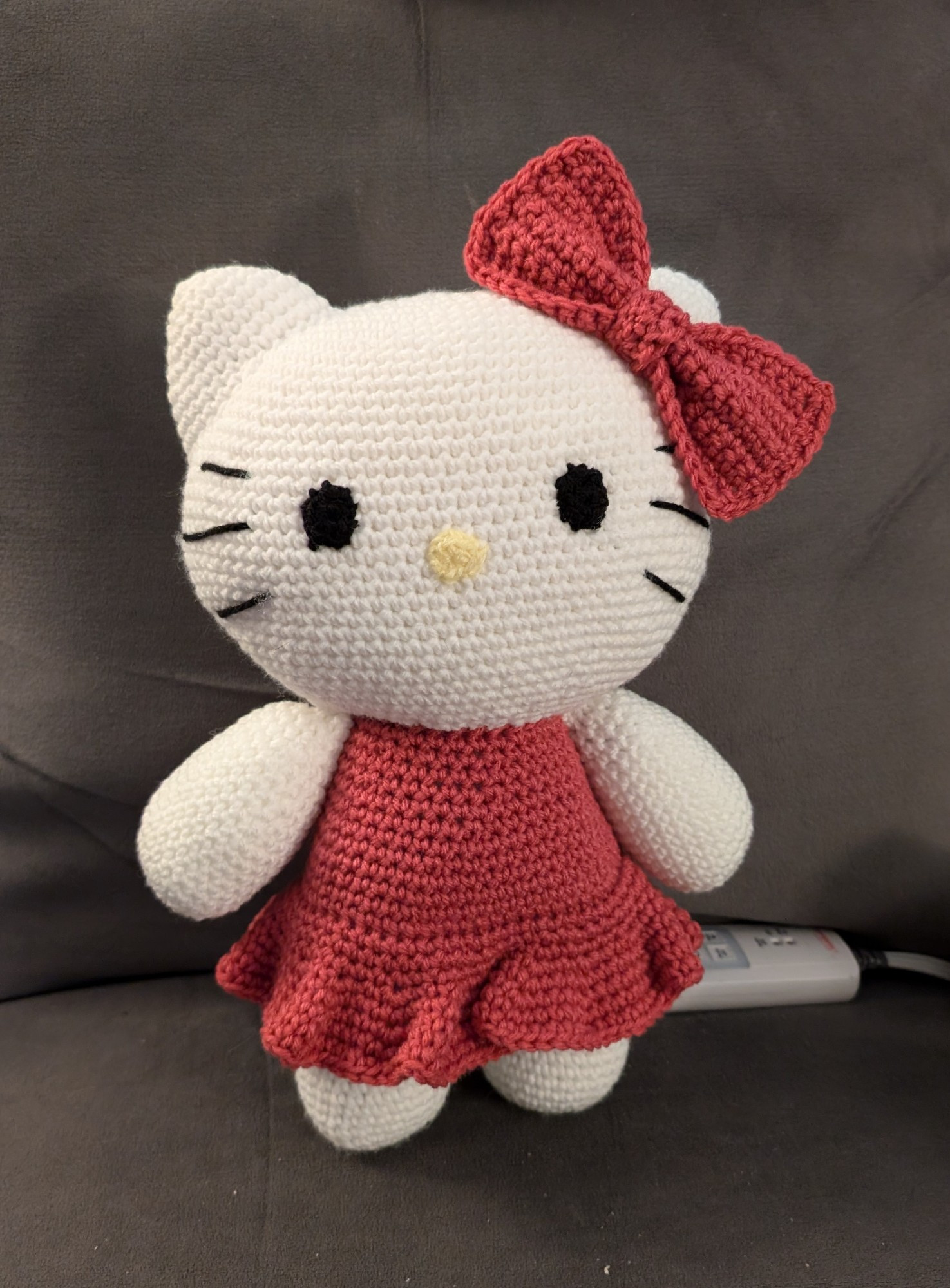 Crocheted hello kitty in a pink dress