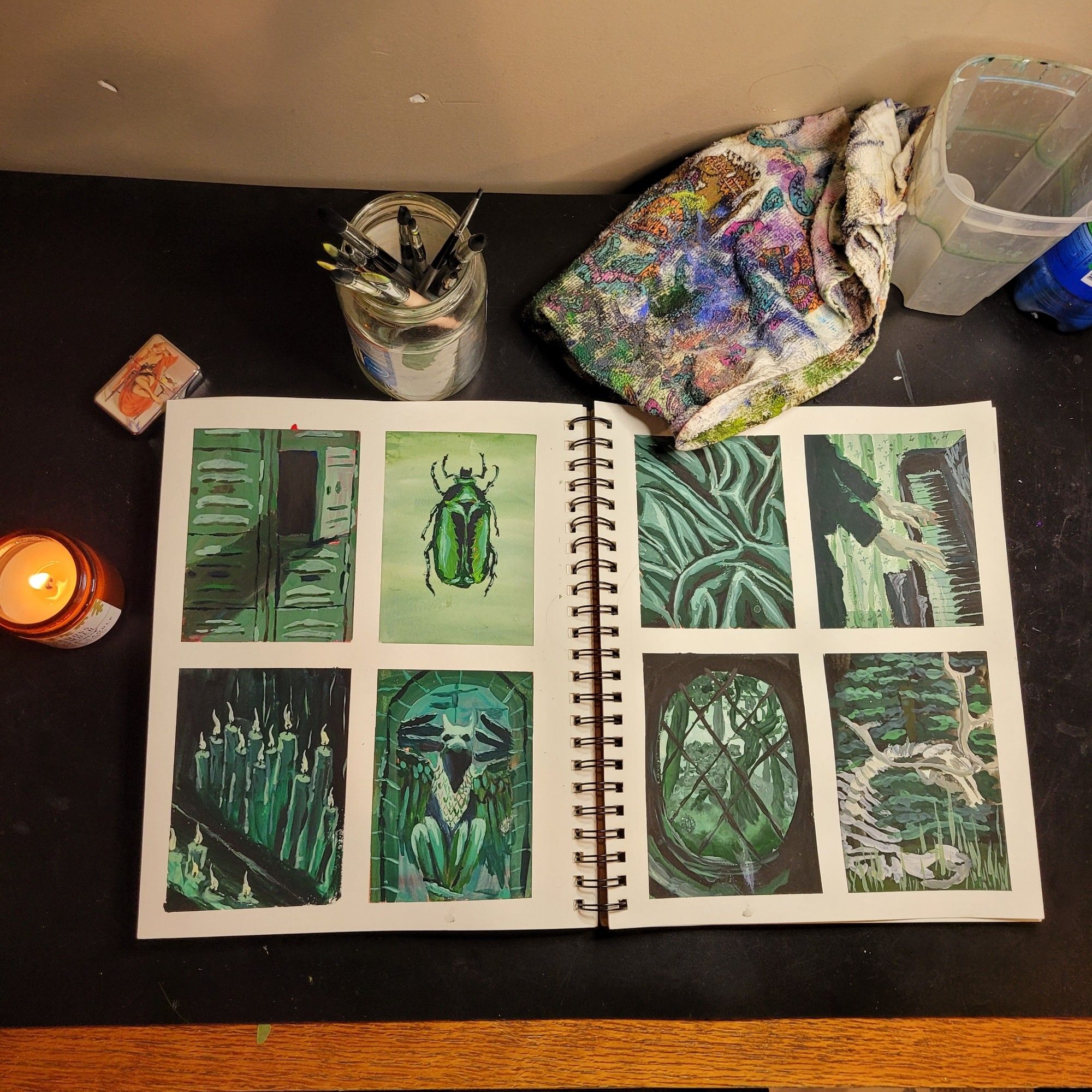 Sketchbook spread of 8 individual guache painting studies in green. From top right to bottom left: painting 1 is a set of lockers, p 2 a beetle, p 3 satin fabric, p 4 hands playing a piano, p 5 burning candles, p 6 griffin statue, p7 landscape through window, p8 elk skeleton