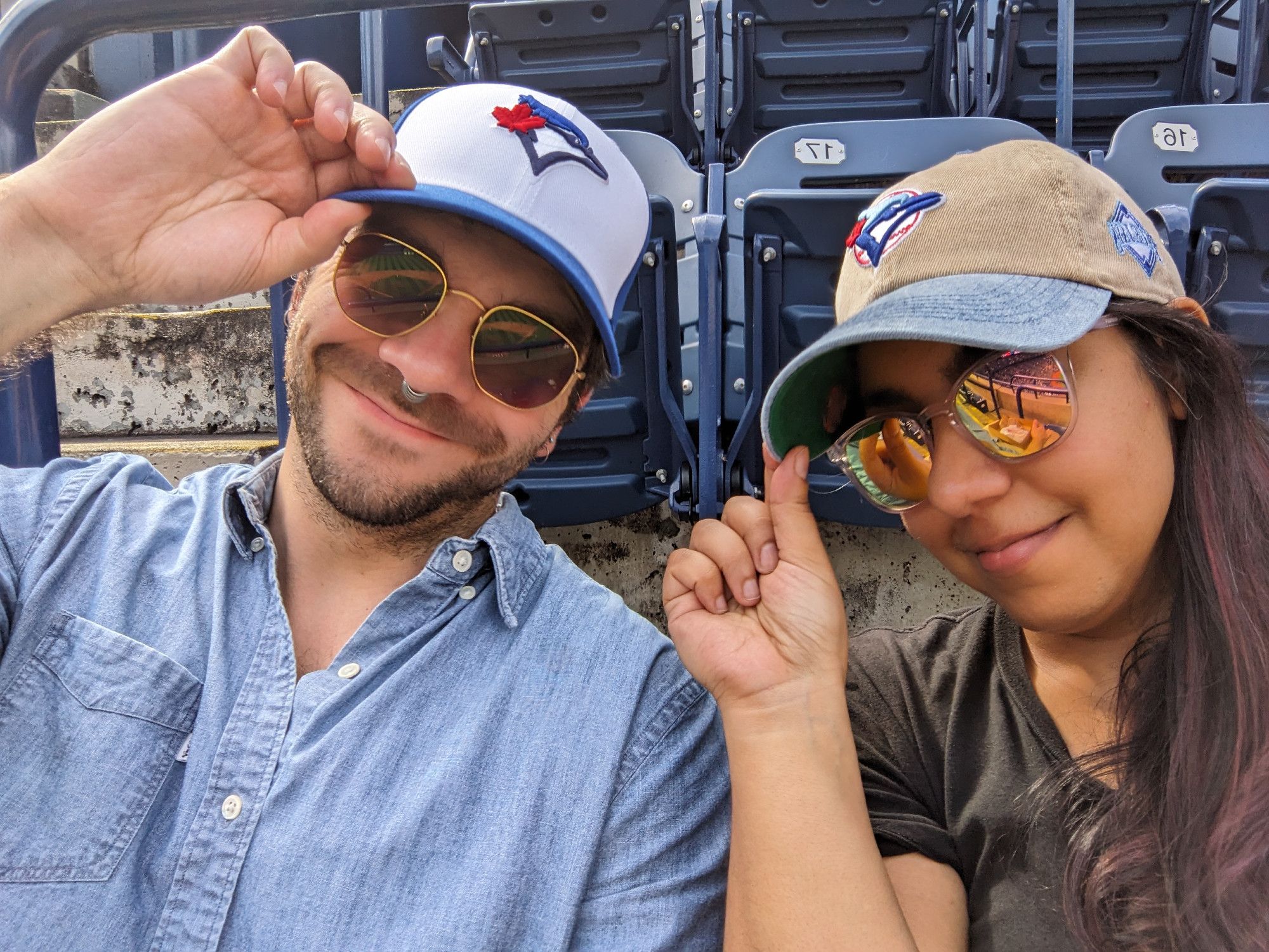 Me and my boyfriend tipping our new Jays caps