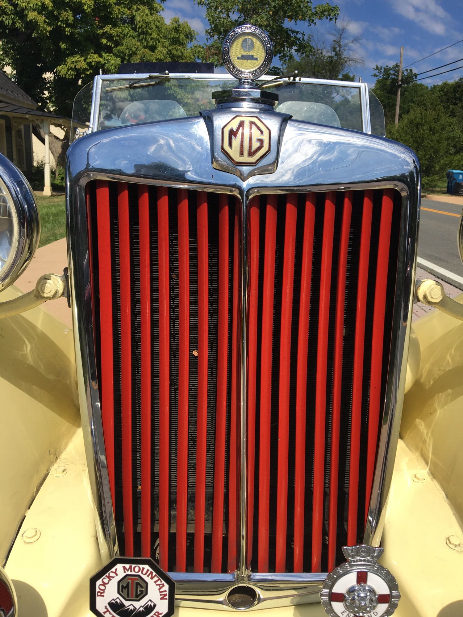 Grill of a 1930s MG grill is red, body is lemon yellow