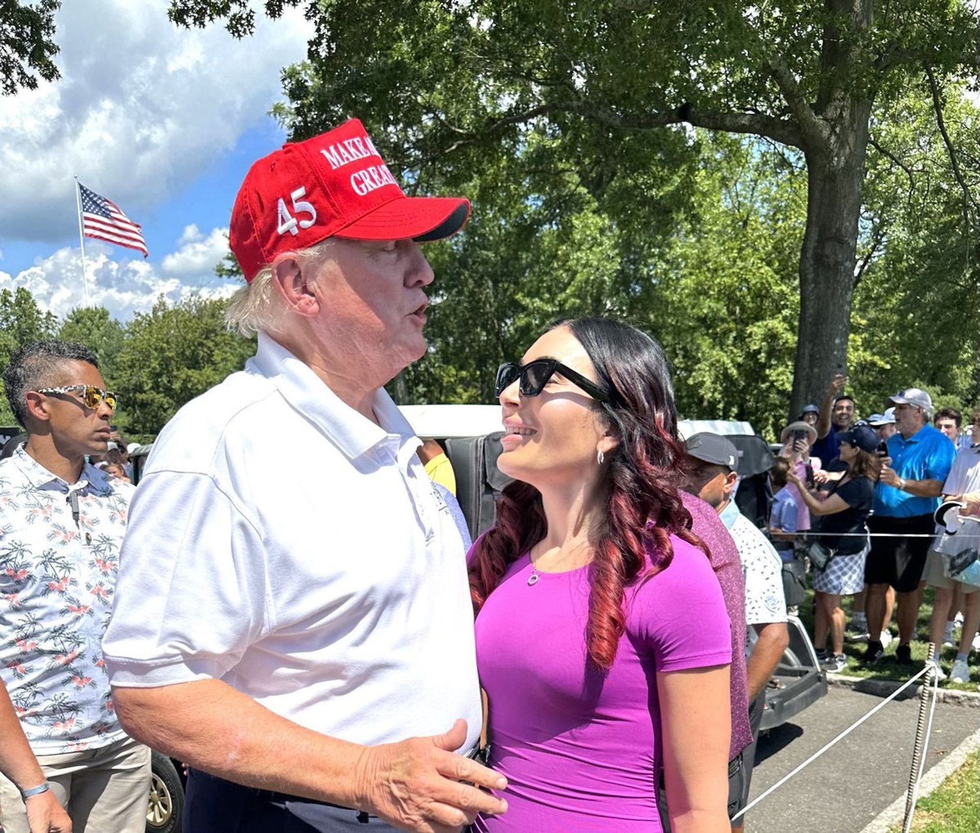 Donald Trump and Laura Loomer very close together eyeing the shit out of each other.