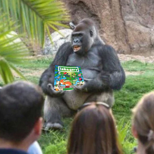 A gorilla holding the new LAKE GARY book and appearing as if he's giving a presentation to a bunch of humans