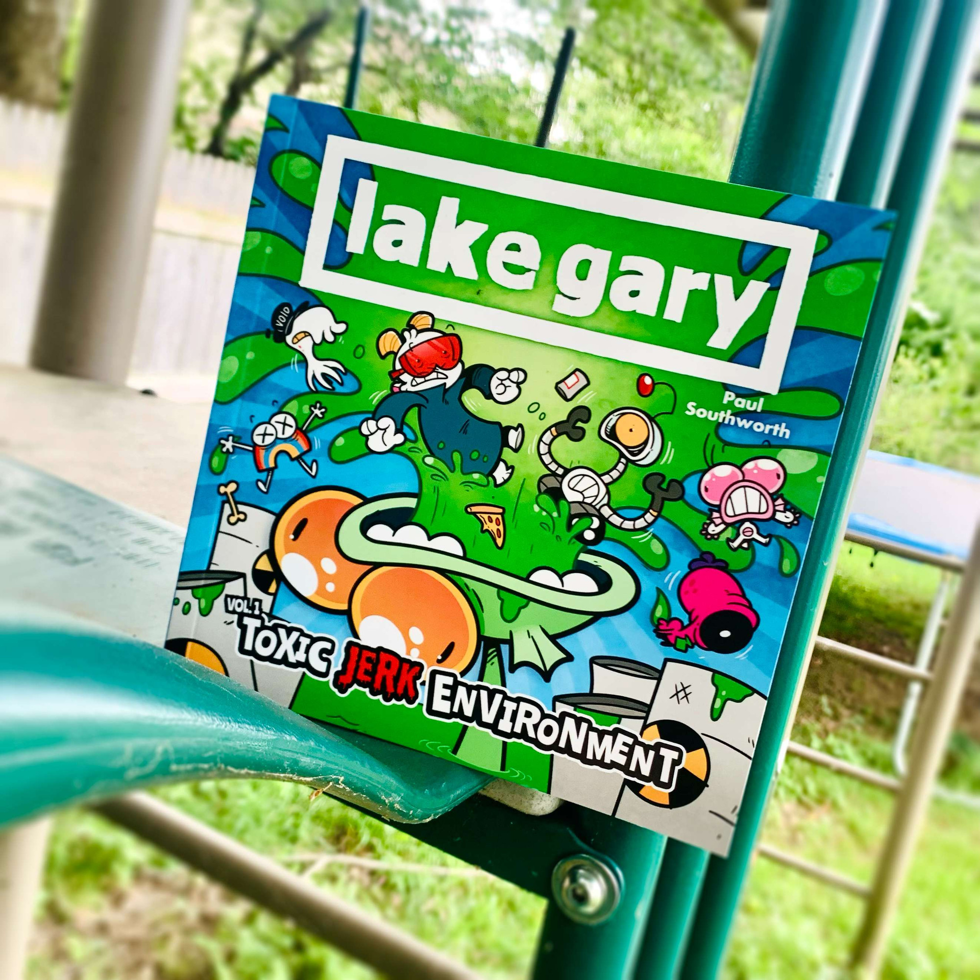 The LAKE GARY book on a swing set!