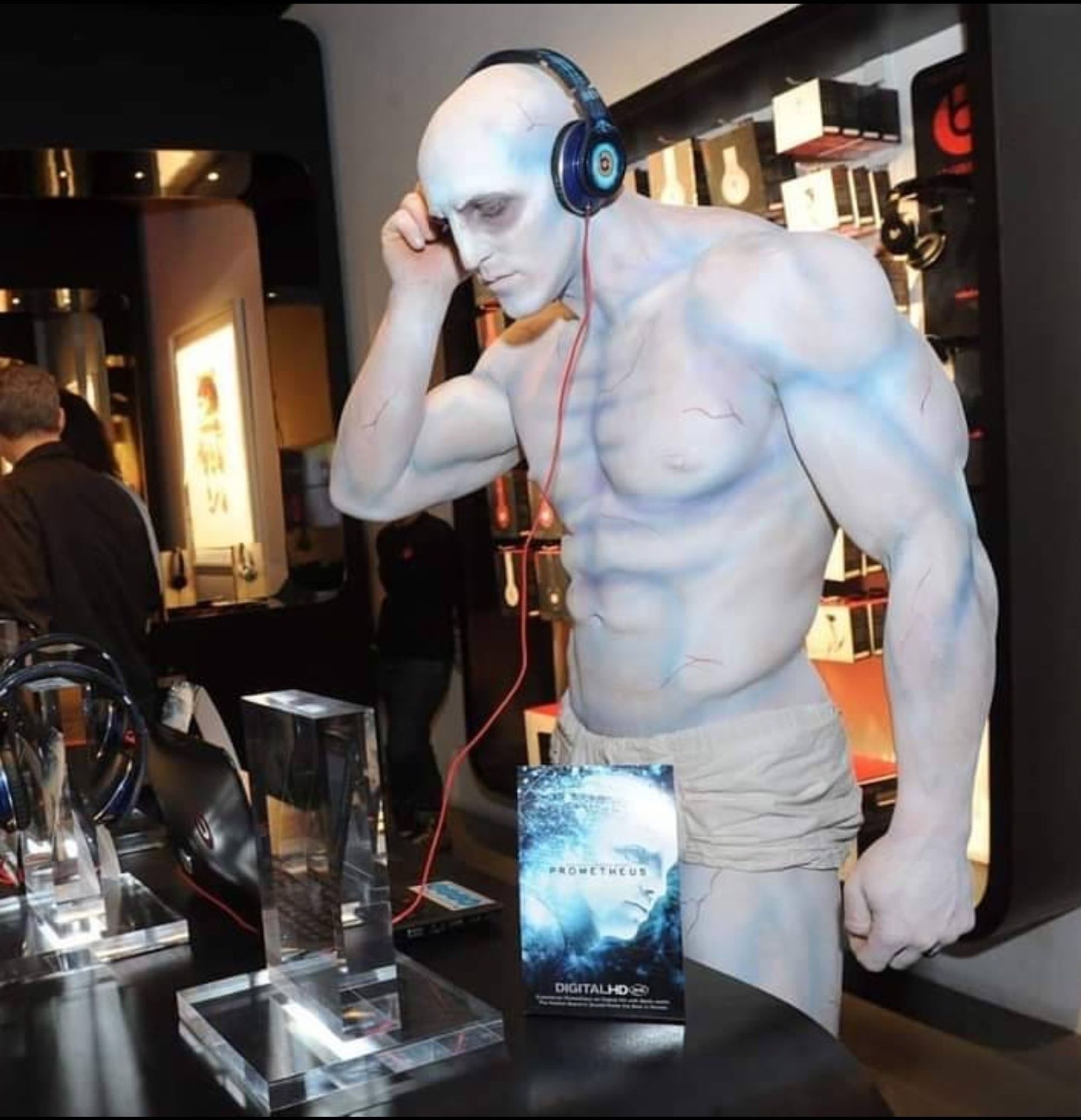 engineer from 'Prometheus' in boxers wearing headphones