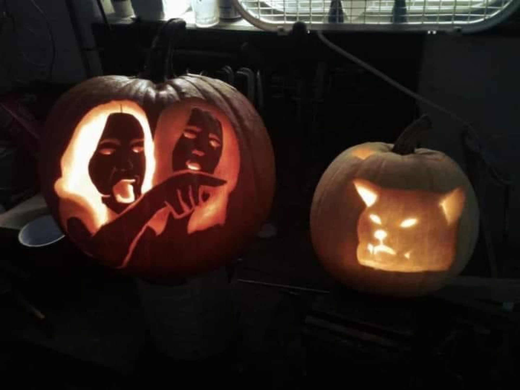 girl pointing at spaghetti eating cat meme in jack o lantern form