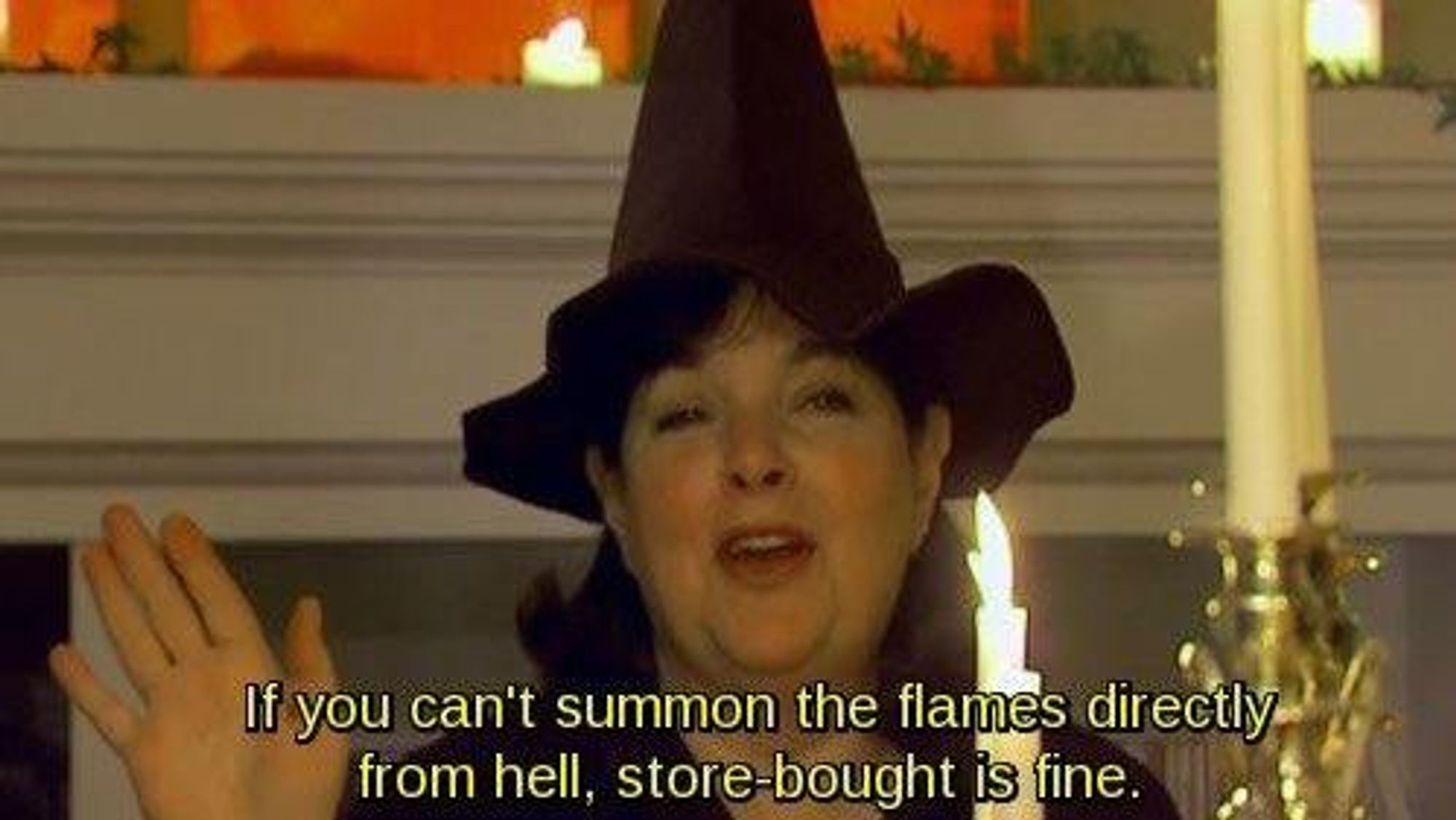 a witch holding a candle saying

if you can't summon the flames directly from hell, store-bought is fine.