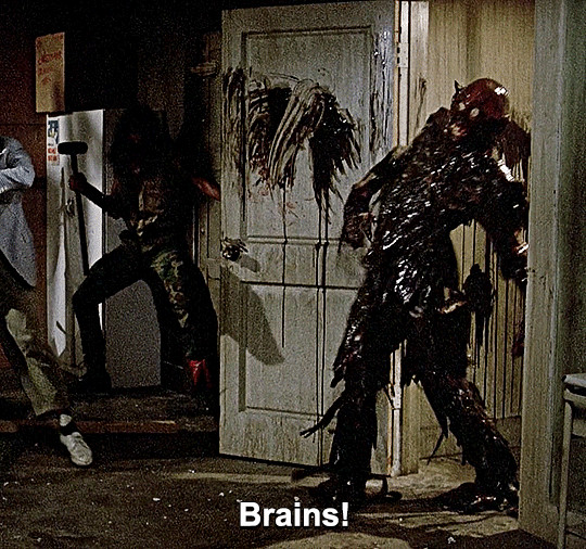 Tarman zombie bursting through a door yelling BRAINS!