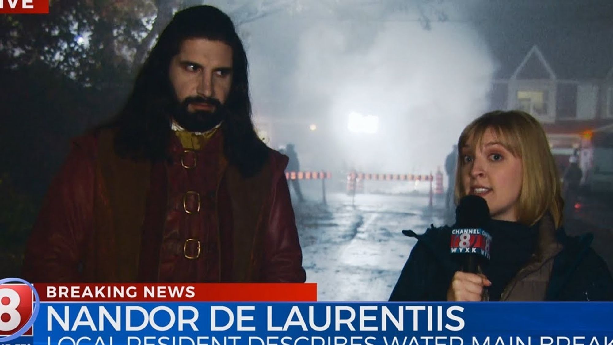 screecap from 'What We Do in the Shadows' showing a television reporter speaking with Nandor captioned 
breaking news
NANDOR DE LAURENTIIS
local resident describes water main break