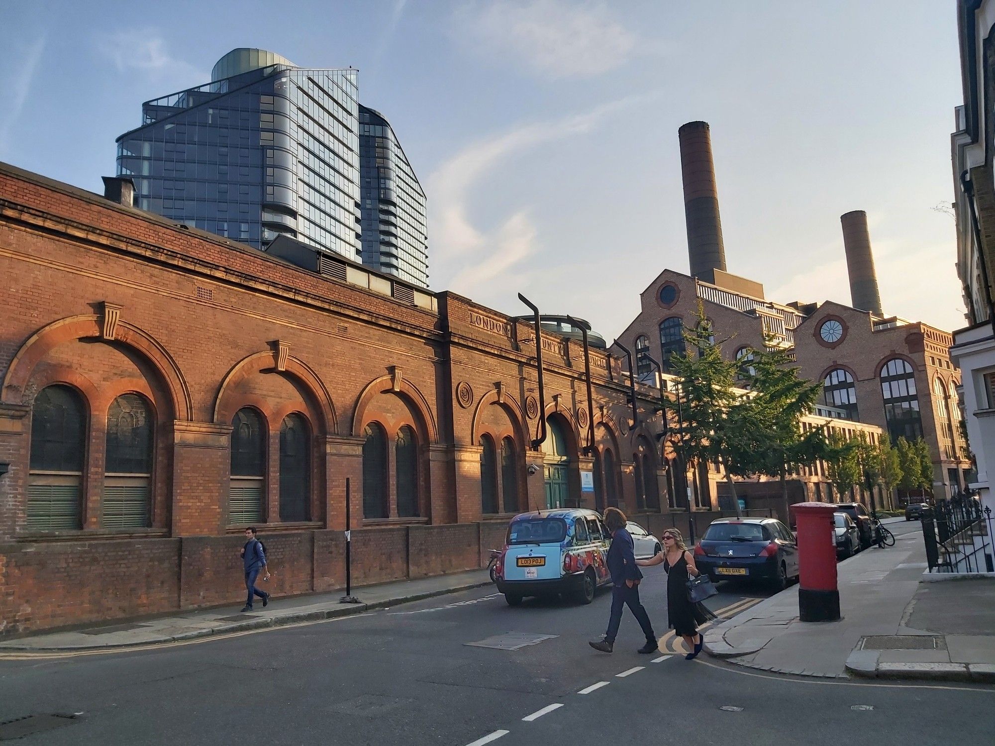 Old Victorian works, a modern tower and two large brick towers. A city scene near a London wharf