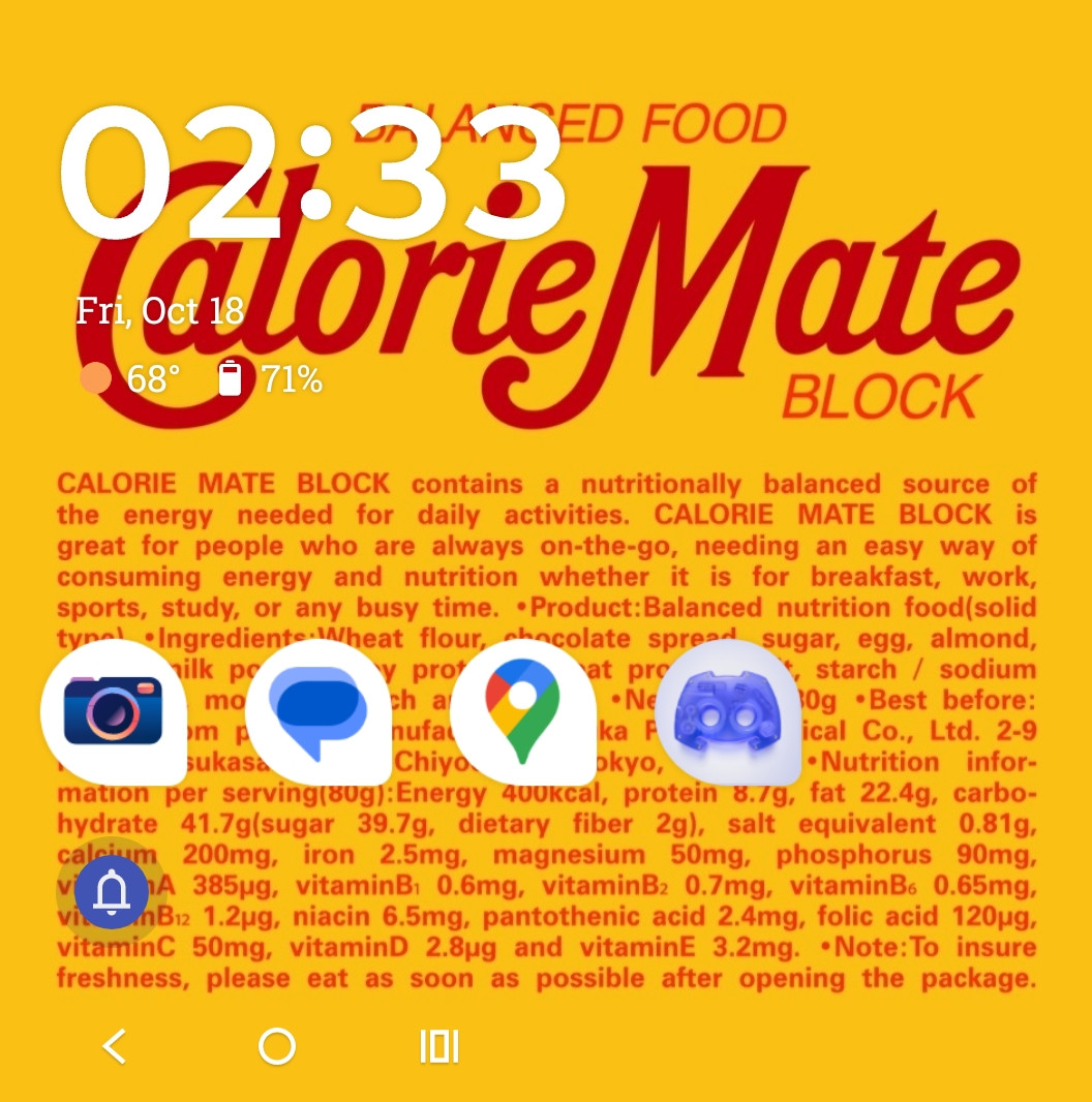 The external screen of my phone, because I have one of those new foldable phones. The wallpaper is the bright yellow packaging of a chocolate Calorie Mate - a brand of Japanese nutritional energy bars that famously collaborated with Metal Gear Solid 3 (and now its remake MGSΔ)

Part of Twitter user Nitroid's series of MG-themed phone wallpapers. You can find this specific one here: https://twitter.com/Nitroid/status/1829641950464786726