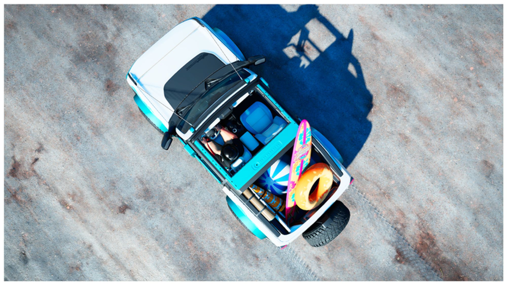 A view from above of a Bronco loaded in the back with beach inflatables and gear.