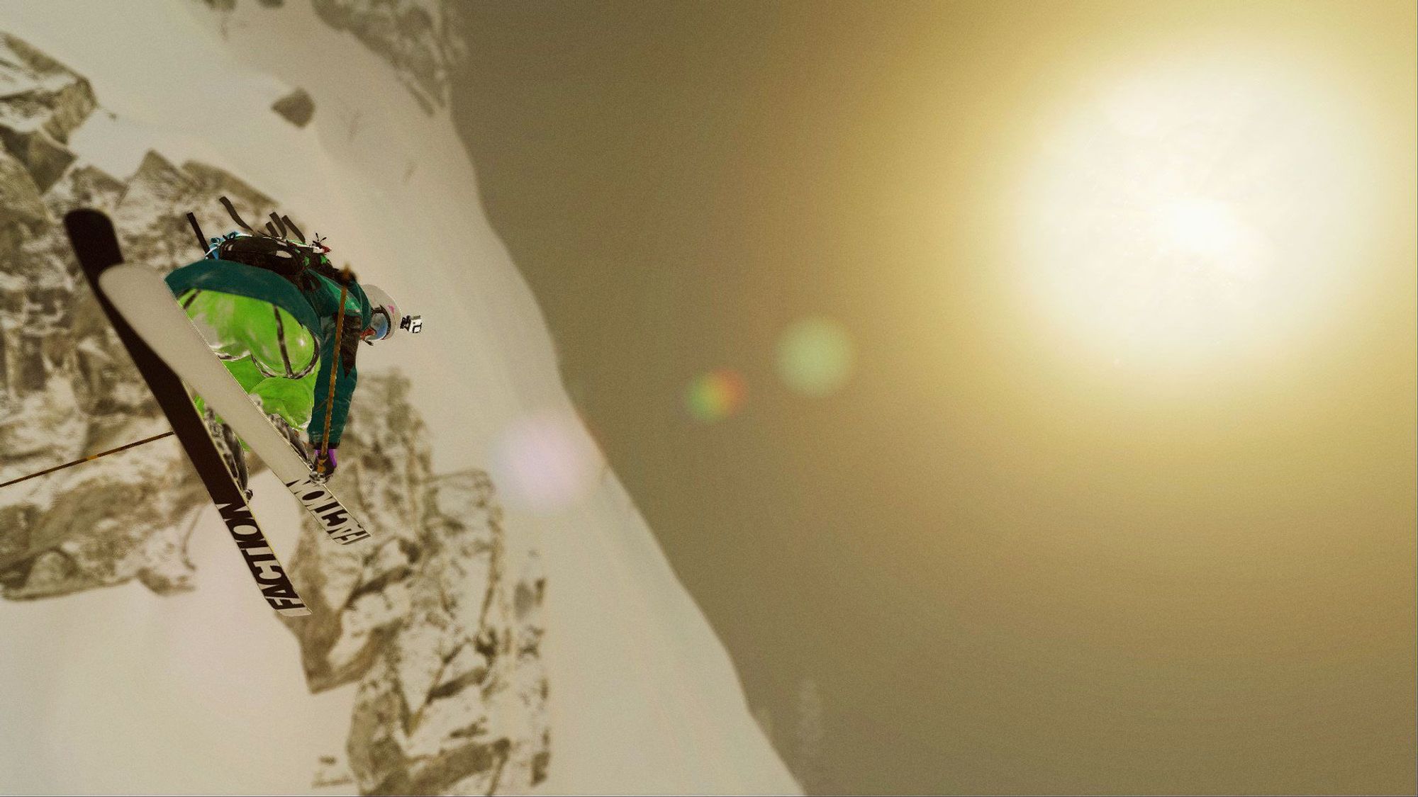 A skier in flight parallel a cliff, holding a safety grab and looking toward her landing, the sun is hazy on the top right.