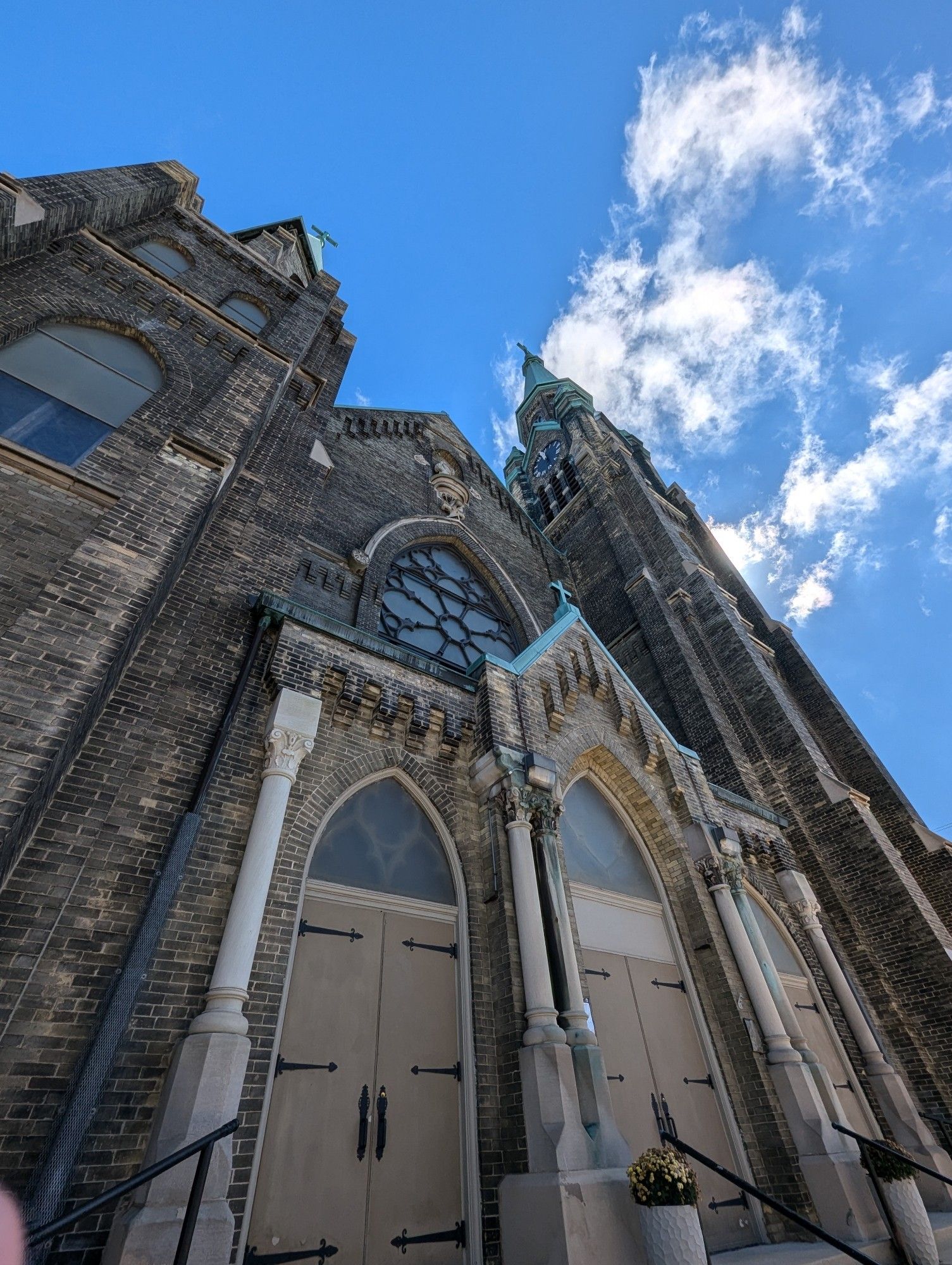 Low angle picture of a decorated church in a Gothic style.