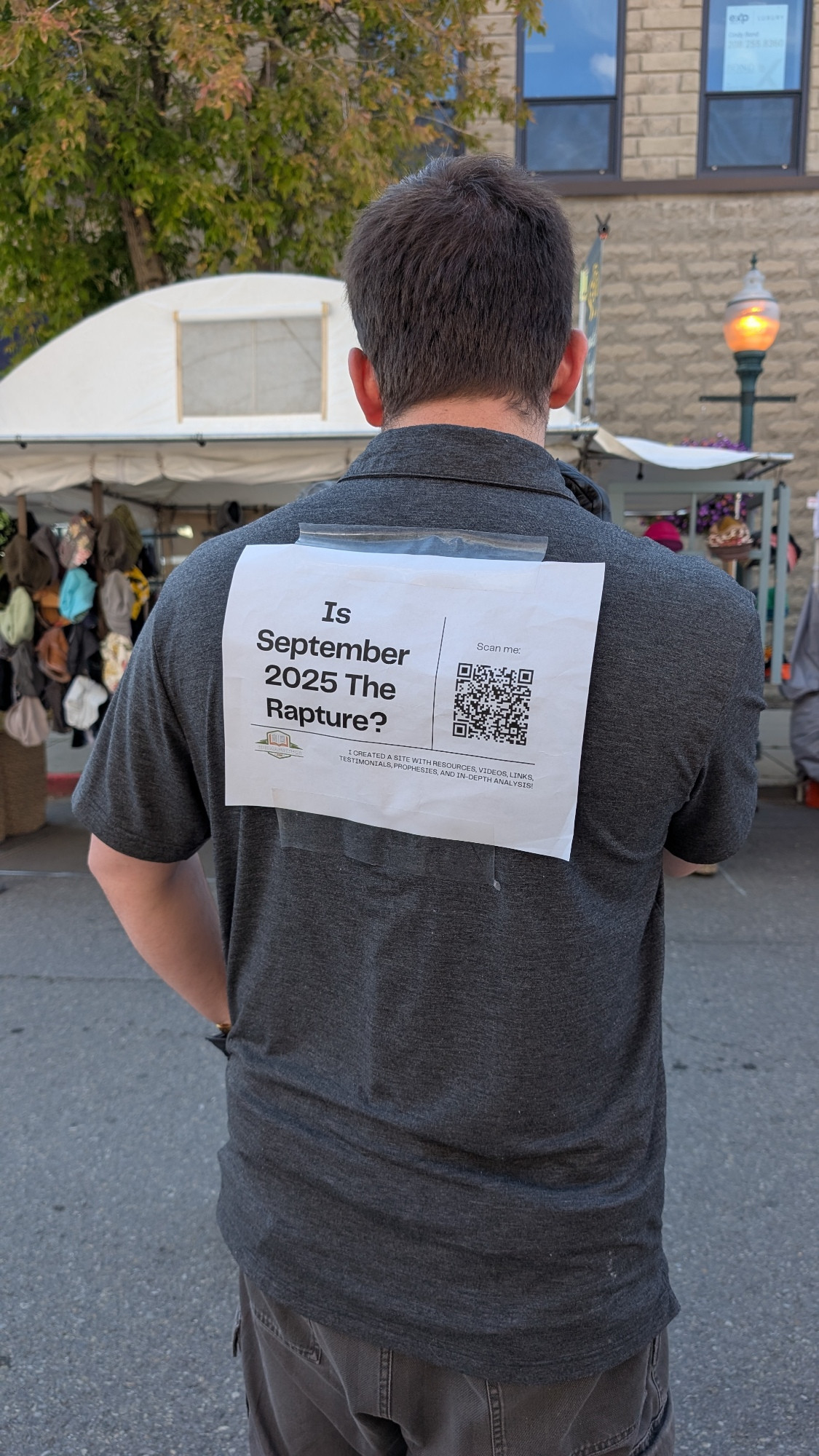 A guy at the arts festival with a sign on his back saying "is September 2025 the Rapture?". There is a QR code that links to a website with a mind-boggling set of links as "evidence" that the answer is yes.