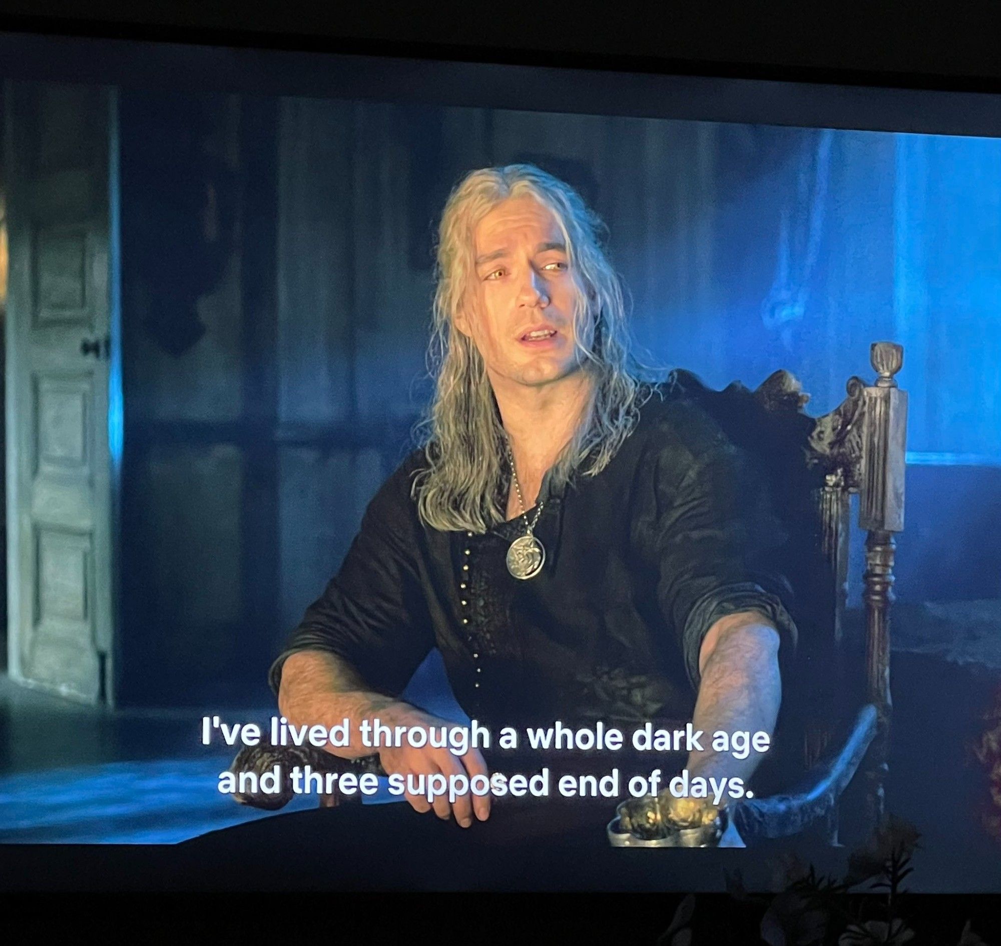 Screenshot from the Witcher TV series with Henry Cavill as Geralt saying, "I've lived through a whole dark age and three supposed end of days."