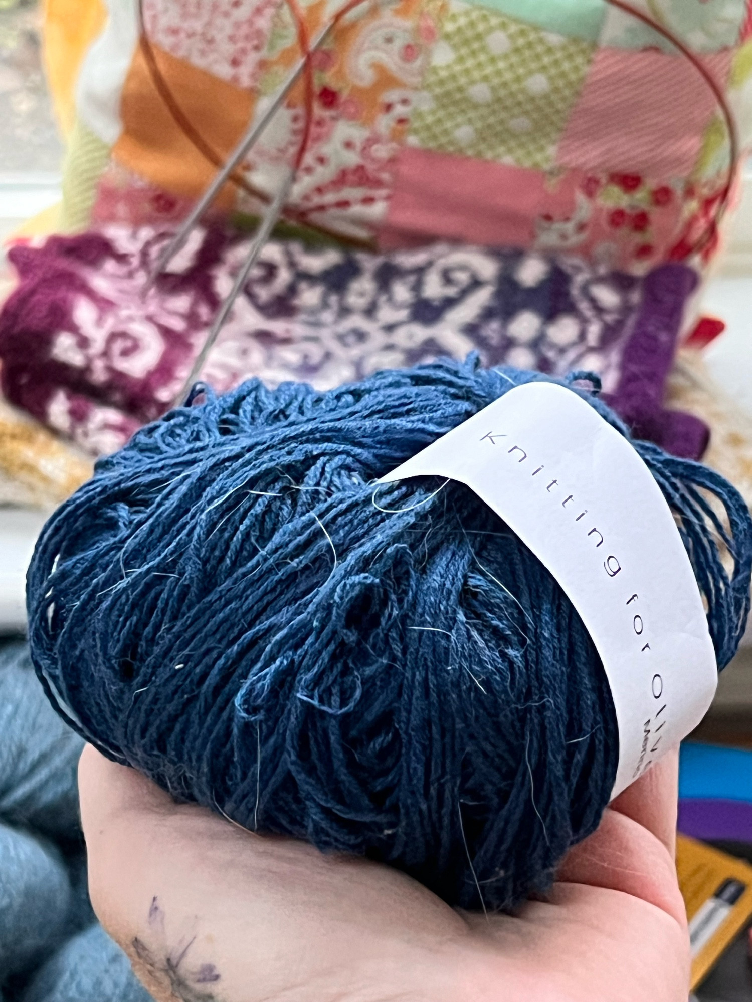 Pictured is a GORGEOUS ball of fine merino in deep ocean blue from the lovely yarn company “Knitting for Olive” that my asshole cats spent the night mangling and pulling apart. Cats are adorable little jerks. 
My poor yarn *sad face* 🧶