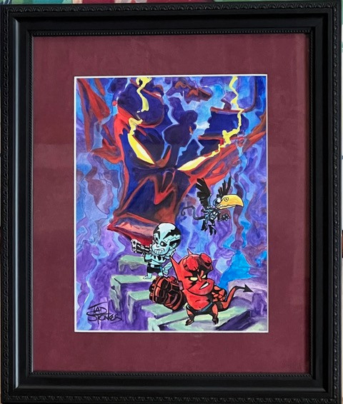 Three Chibi-like versions of Hellboy, Abe Sapien and a crow walk down steps. A giant devil head looms out of the mist behind them.