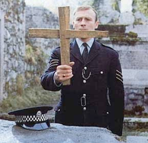 Sgt. Howie from The Wicker Man (1973) making a cross from some broken wood in a deconsecrated church, determined to make this island of modern pagans return to Christianity by force.