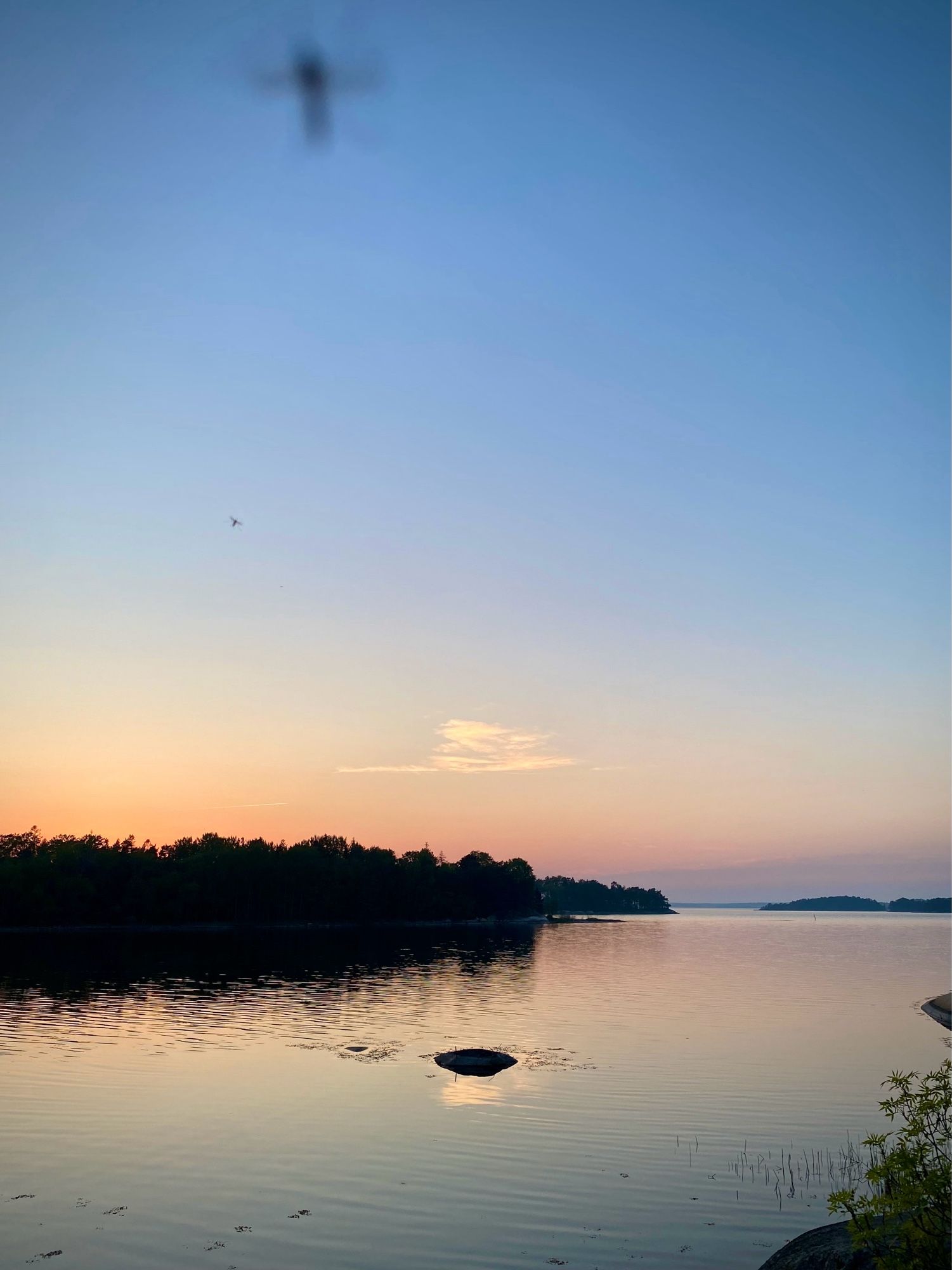 Archipelago sunset view with islands along the skyline.