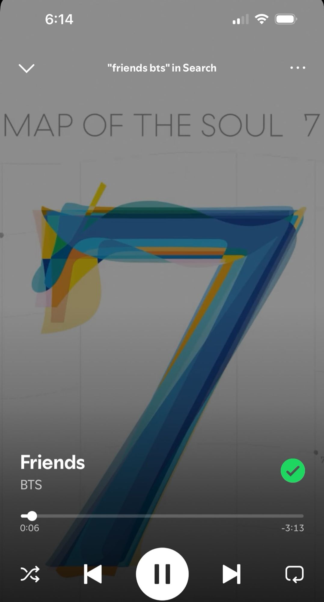 A screenshot of the BTS song friends playing on Spotify. It shows the cover of Map of the Soul: 7.  The background is white and the title of the album is at the top in plain blue lettering. In the center is a large number 7. It’s made up of 7 overlapping sevens (one for each member of the group) in different fonts and varying shades of blue and yellow.